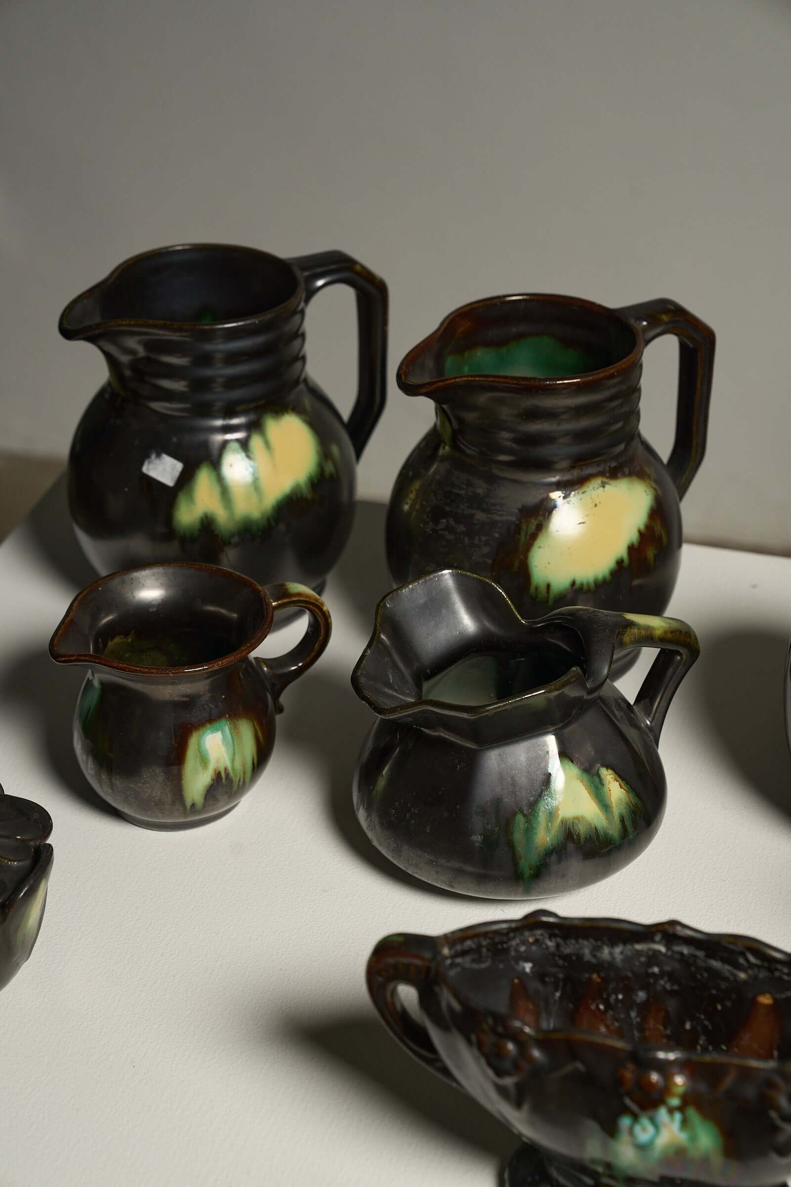 Large Collection of Belgian Art Deco Drip Glaze Ceramics 1920s featuring pitchers with flammé glaze.