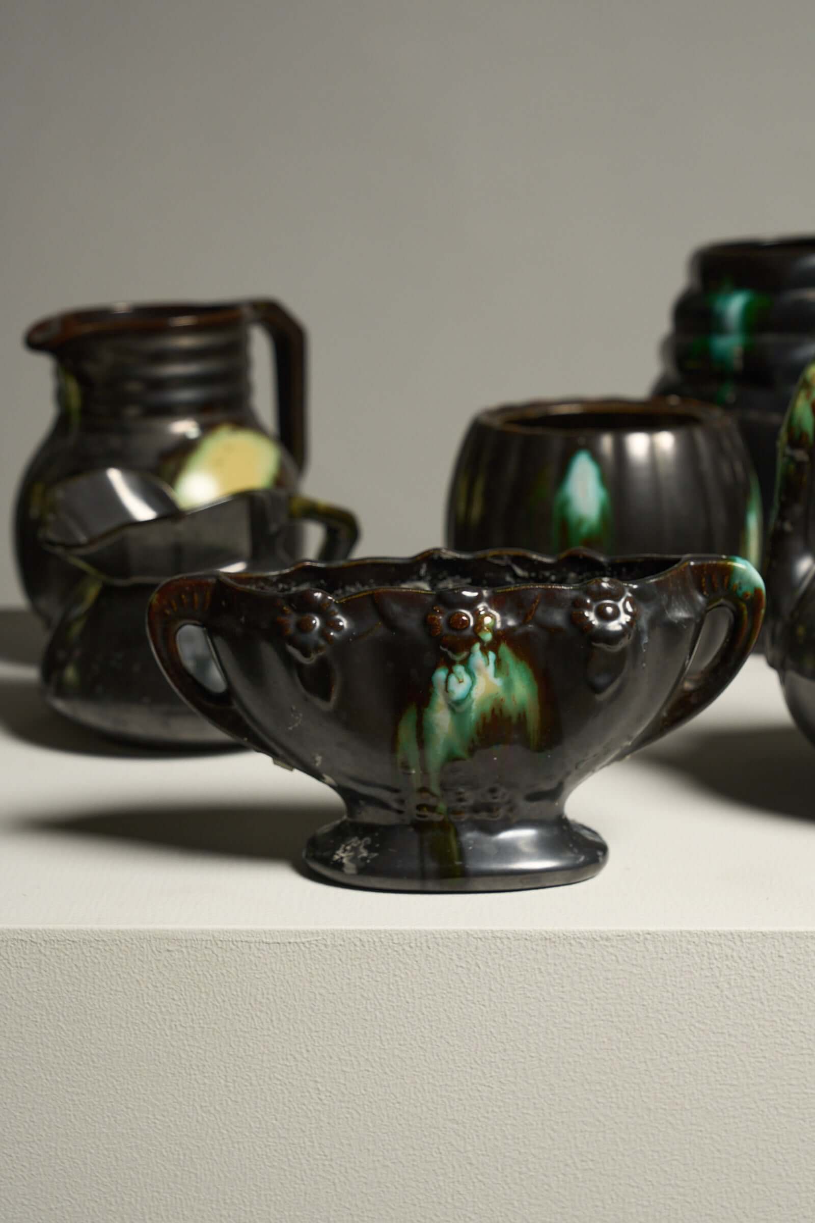 Large Collection of Belgian Art Deco Drip Glaze Ceramics 1920s featuring drip-glazed vases and pitchers.