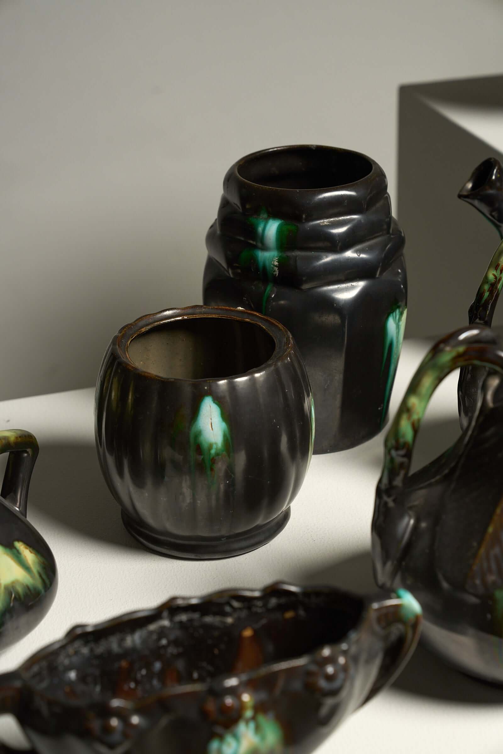 Large Collection of Belgian Art Deco Drip Glaze Ceramics 1920s featuring glazes in emerald green and ochre.