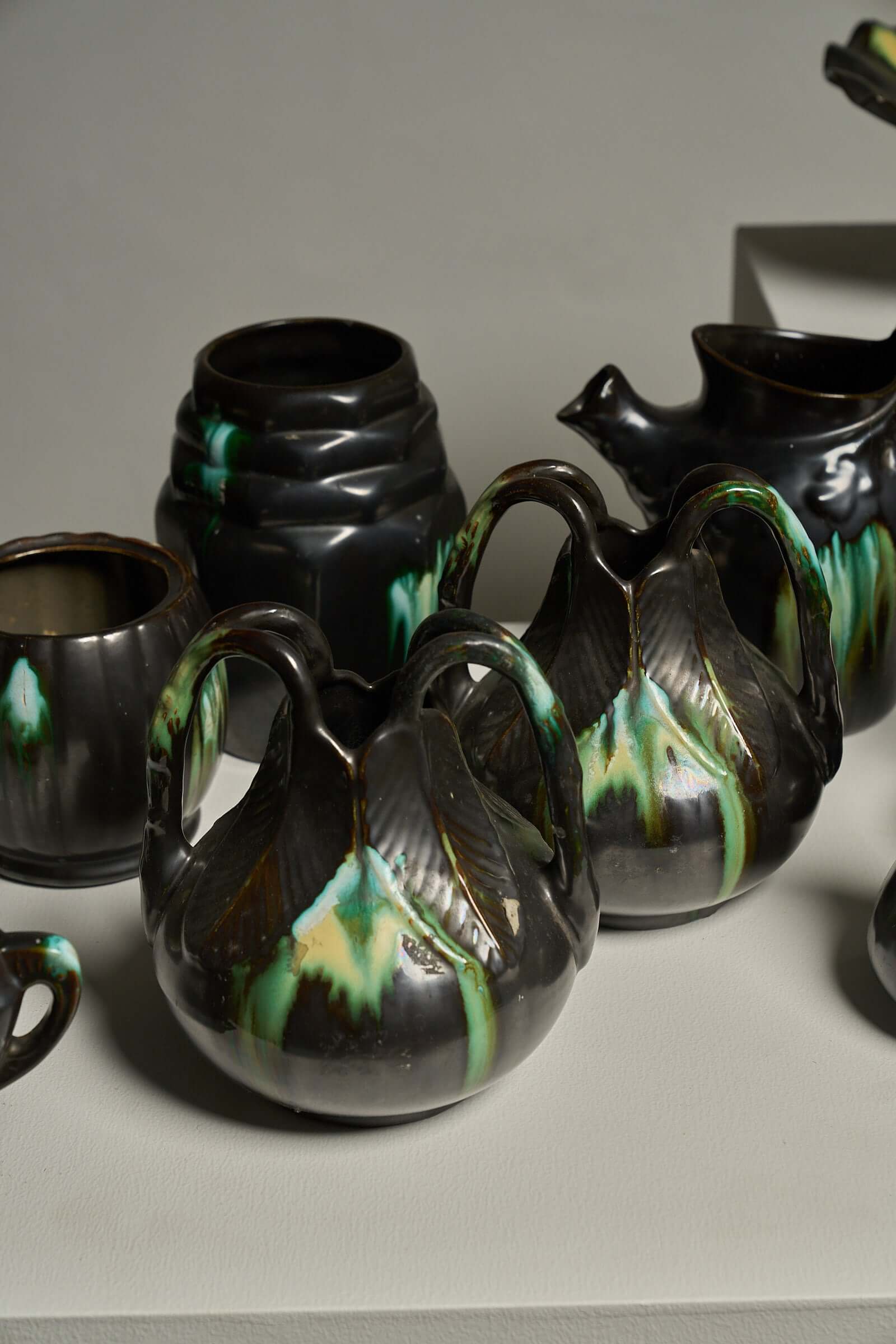 Large Collection of Belgian Art Deco Drip Glaze Ceramics 1920s featuring diverse vases and pitchers with unique glazes.
