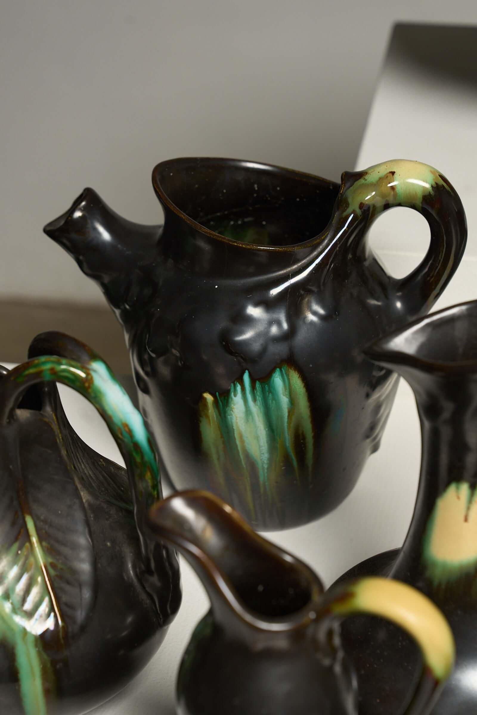 Large Collection of Belgian Art Deco Drip Glaze Ceramics 1920s featuring detailed ceramic pitchers.