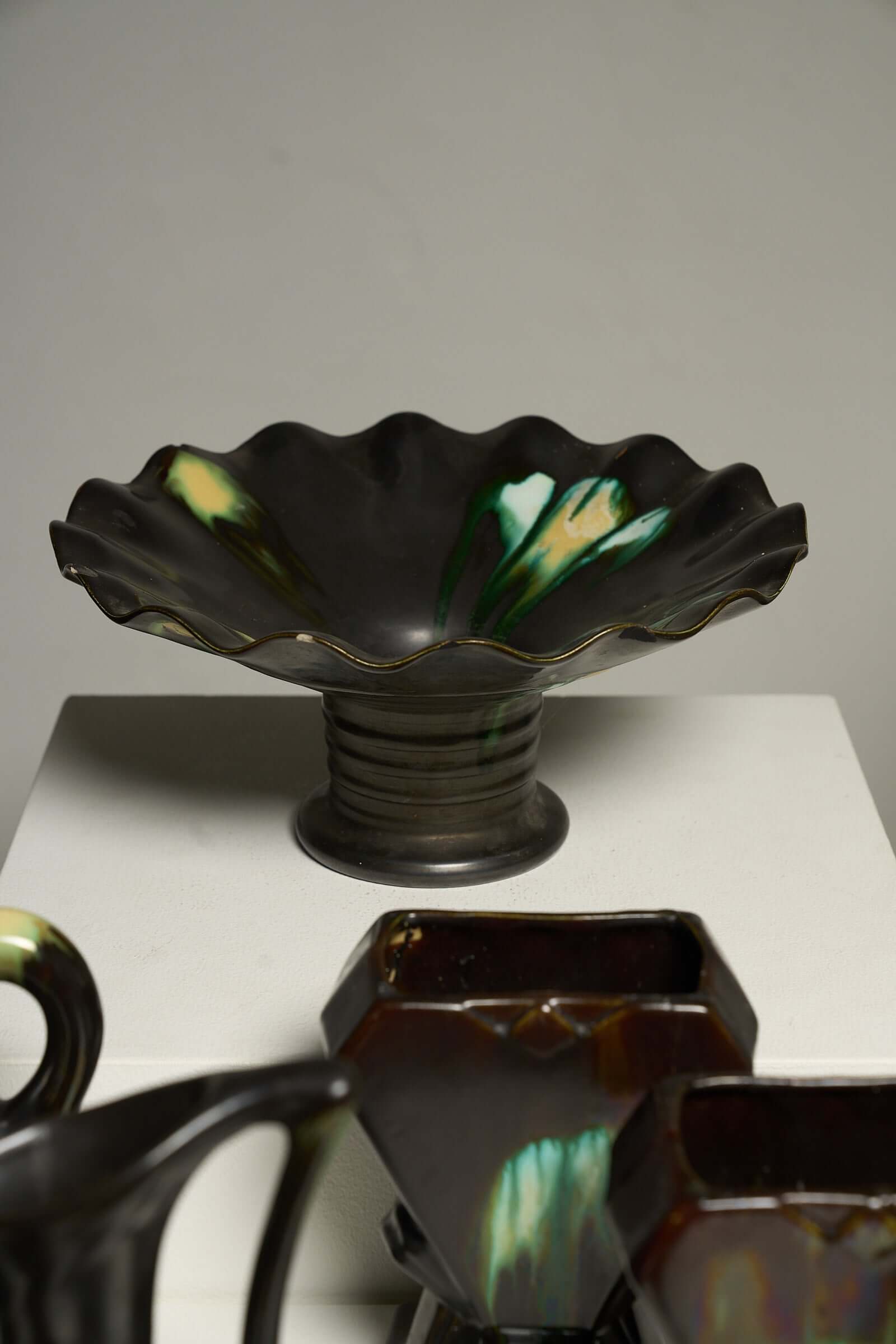 Large Collection of Belgian Art Deco Drip Glaze Ceramics 1920s including a scalloped black bowl.