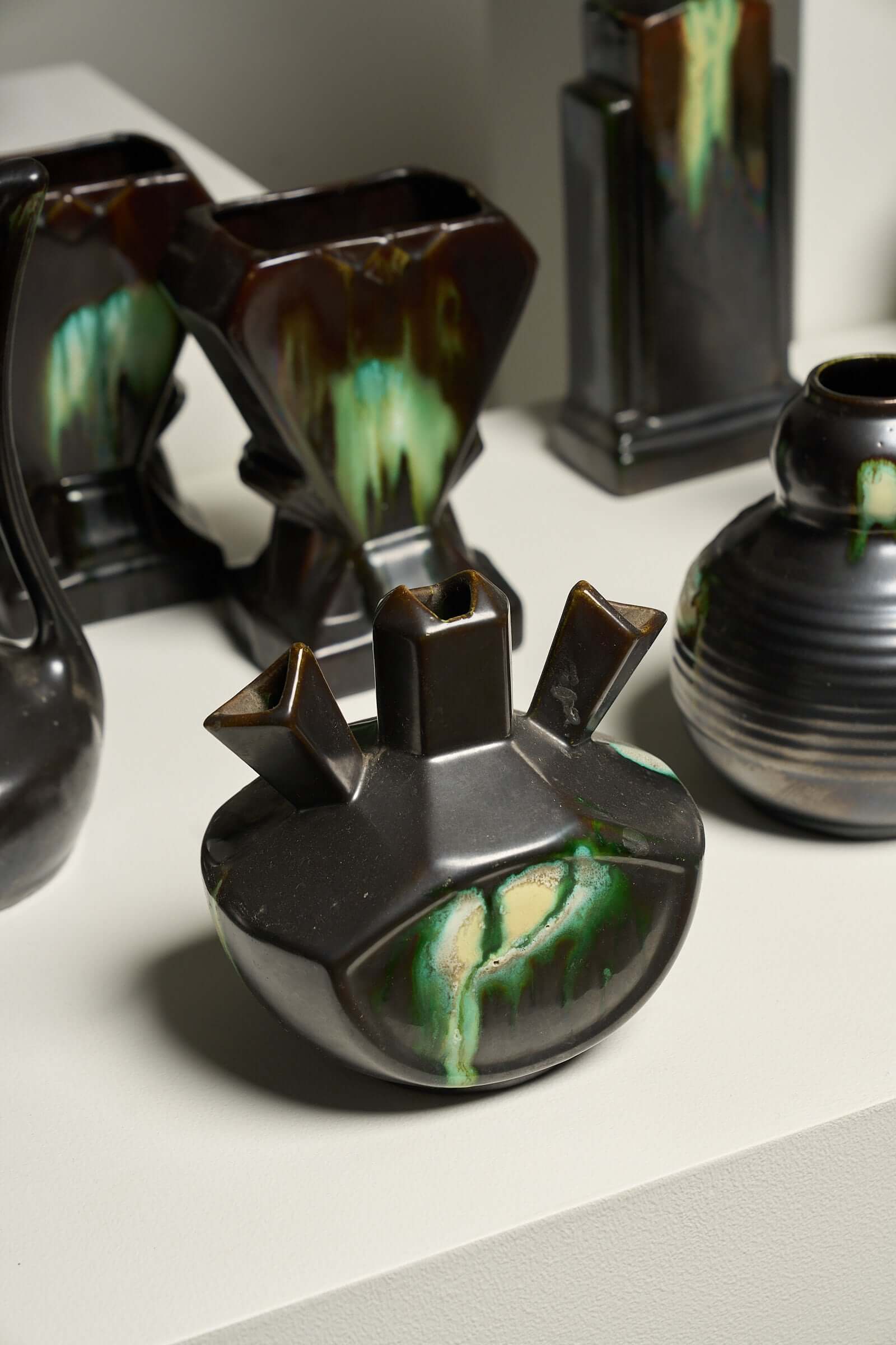 Large Collection of Belgian Art Deco Drip Glaze Ceramics 1920s featuring diverse ceramics with flammé glaze.