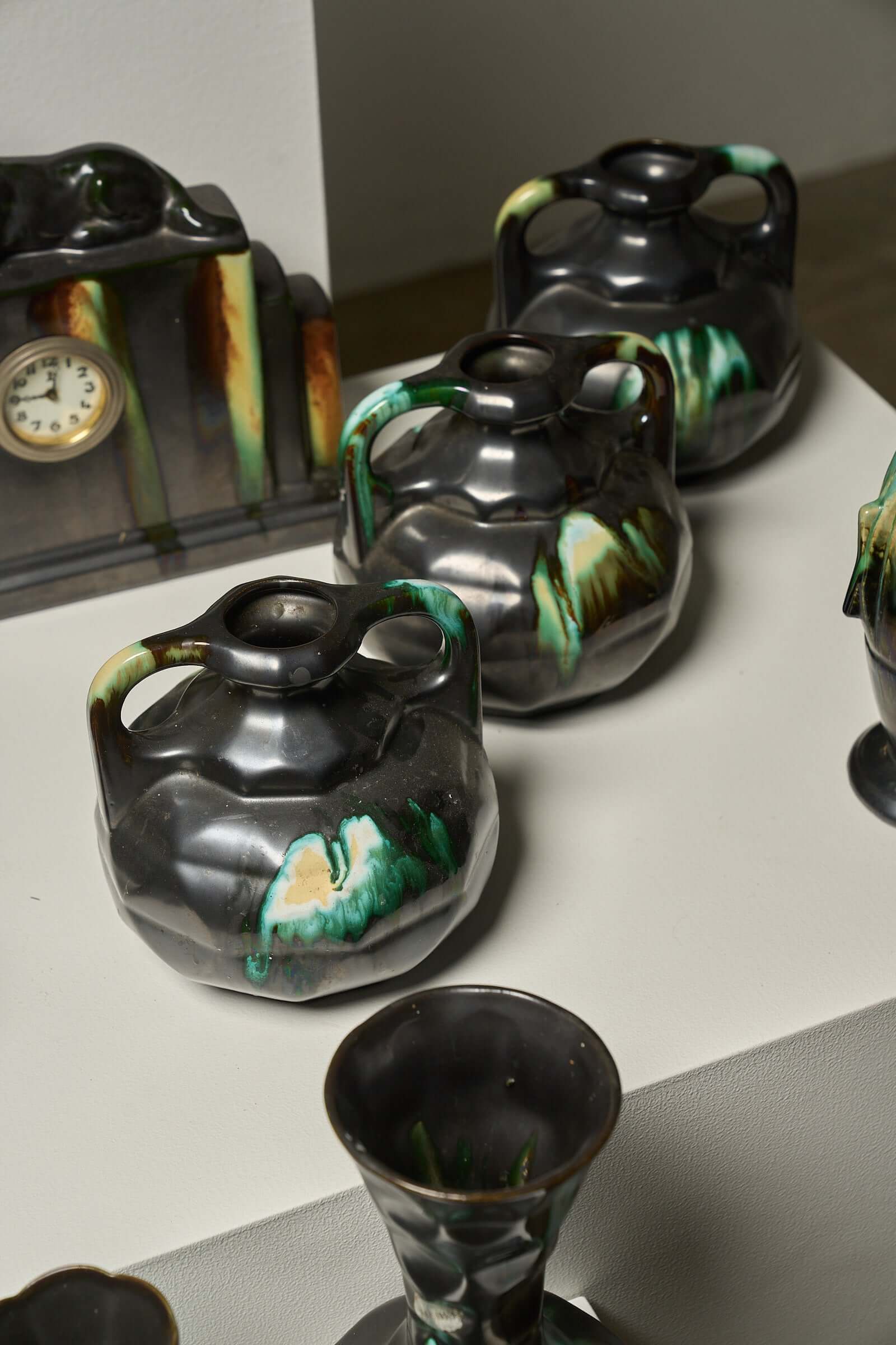 Large Collection of Belgian Art Deco Drip Glaze Ceramics 1920s featuring unique pitchers and vase designs.