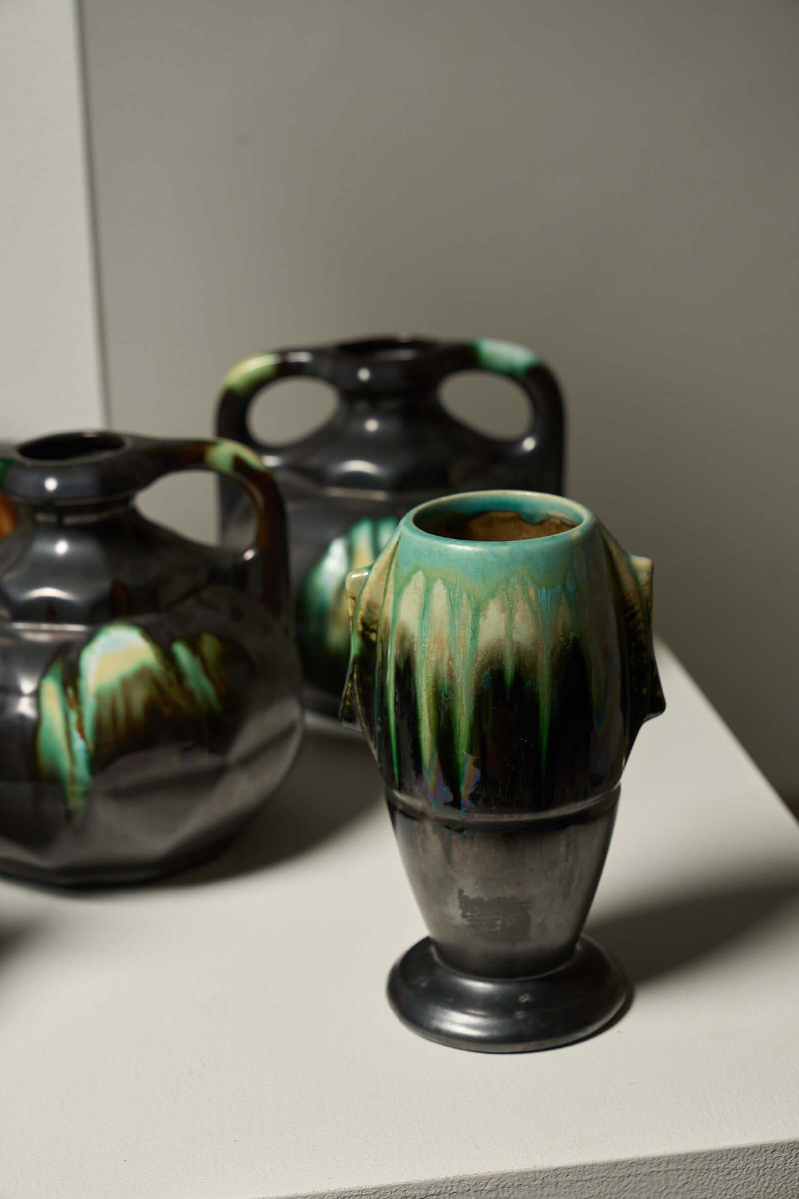 Large Collection of Belgian Art Deco Drip Glaze Ceramics 1920s featuring unique vases and pitchers with flammé glaze.