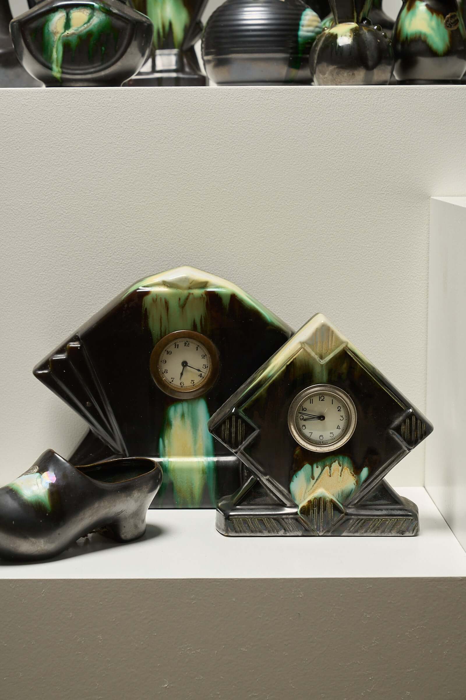 Large Collection of Belgian Art Deco Drip Glaze Ceramics 1920s featuring mantel clock cases and decorative shoe.
