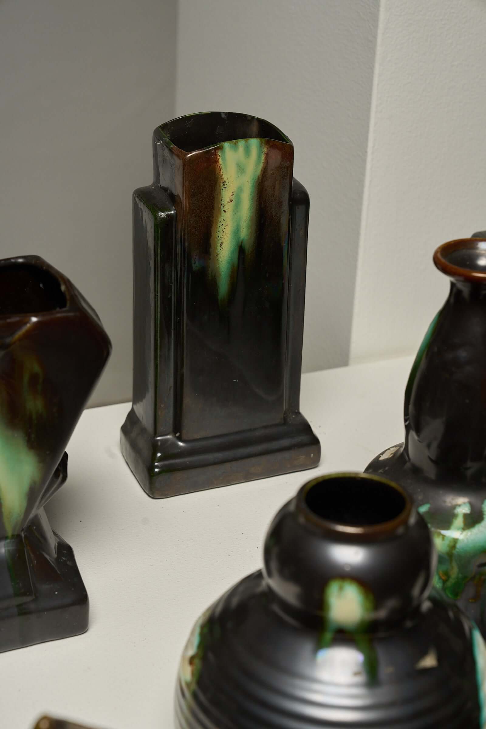 Large Collection of Belgian Art Deco Drip Glaze Ceramics 1920s featuring a range of vases and pitchers in flammé glaze.