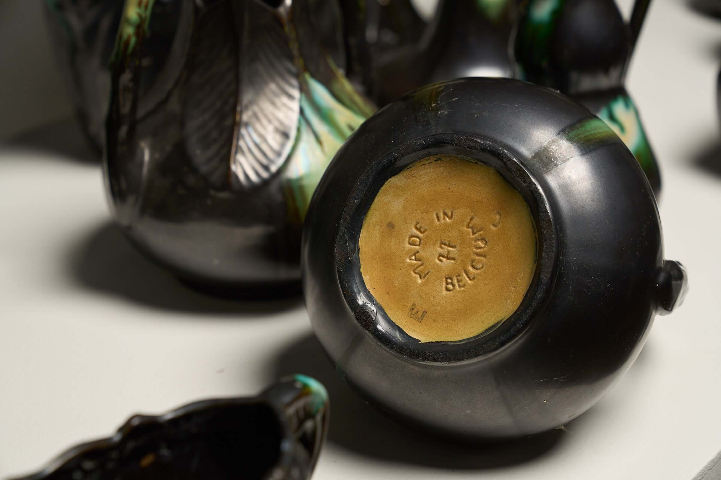 Large Collection of Belgian Art Deco Drip Glaze Ceramics 1920s - close-up of base showcasing 'Made in Belgium' mark.
