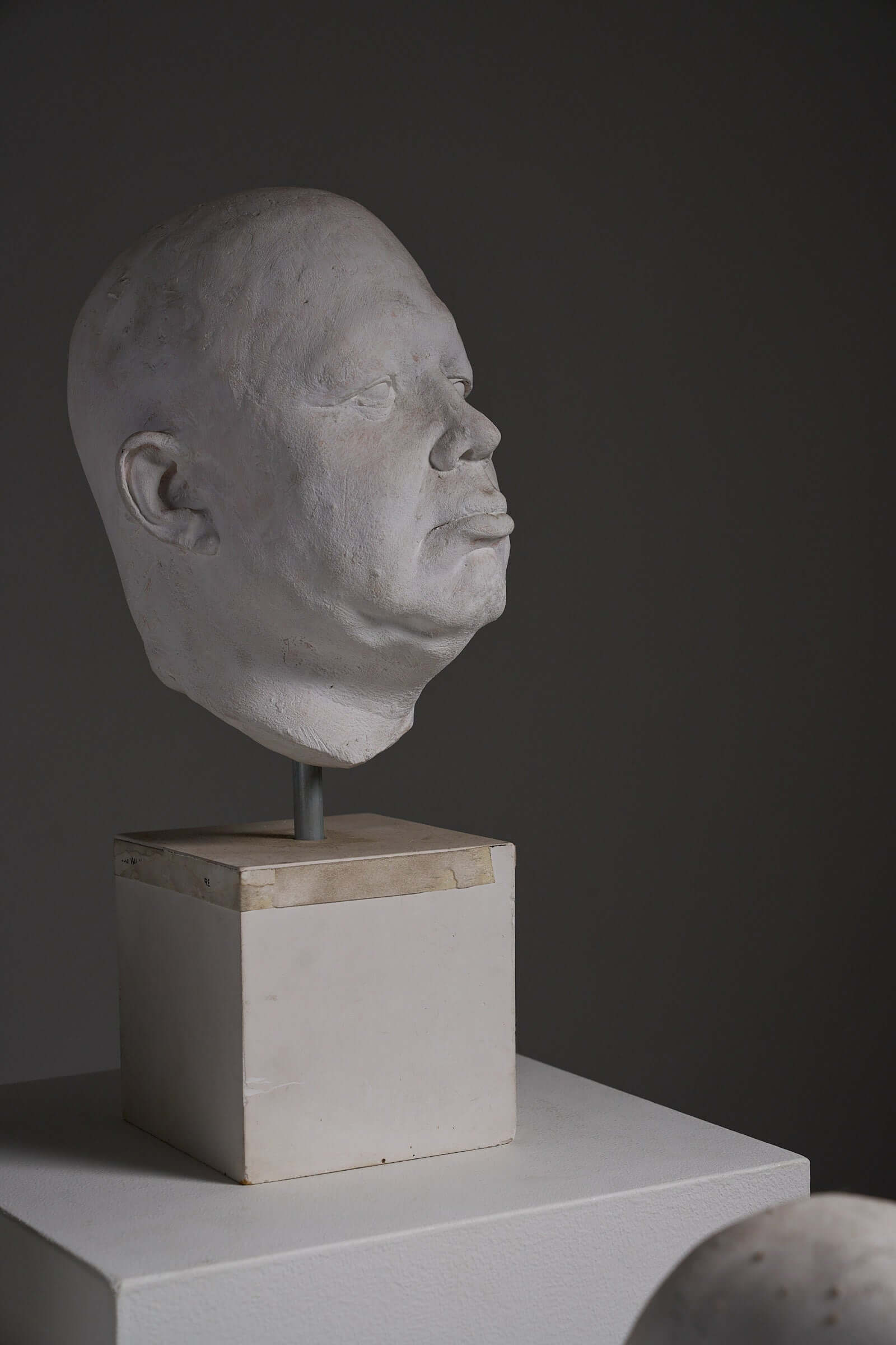 Set of Four Plaster Heads on Plinths displayed in an art studio, showcasing detailed life cast sculpture.