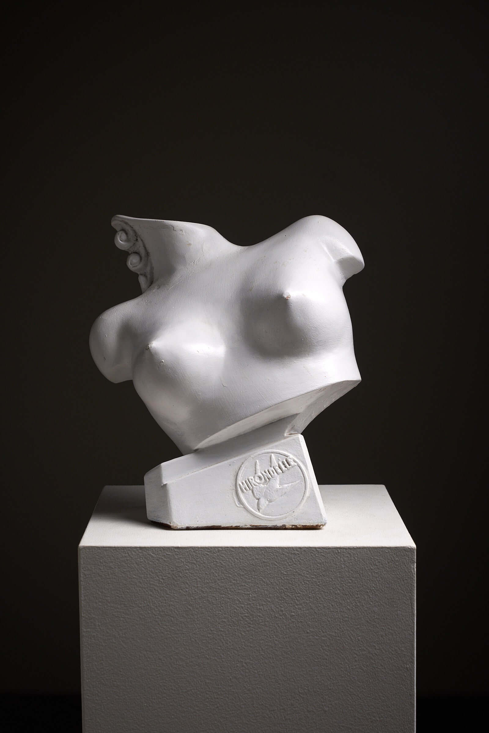 Mid-Century Plaster Display Busts by Hirondelle on a pedestal showcasing its unique design.