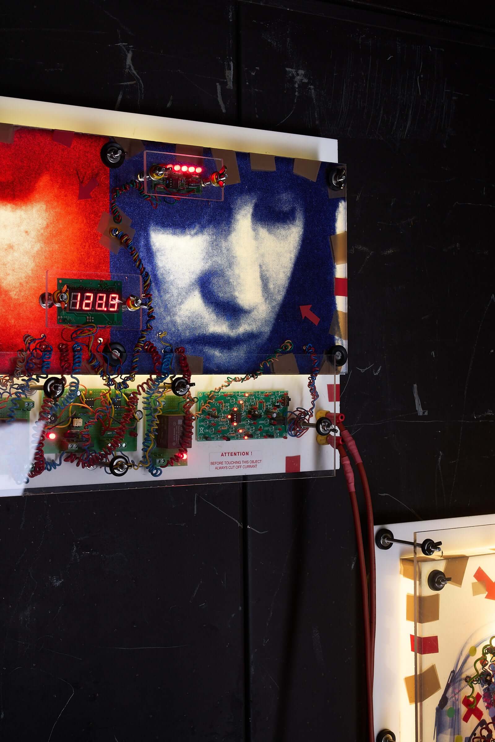 The Ulrike Meinhof Shopping Bag Installation by Eduard Van Giel (2017) mixed-media artwork featuring electronic components.