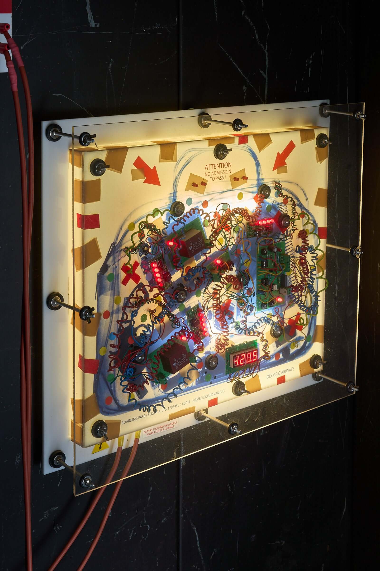 The Ulrike Meinhof Shopping Bag Installation by Eduard Van Giel (2017), mixed-media artwork with lights and circuits.