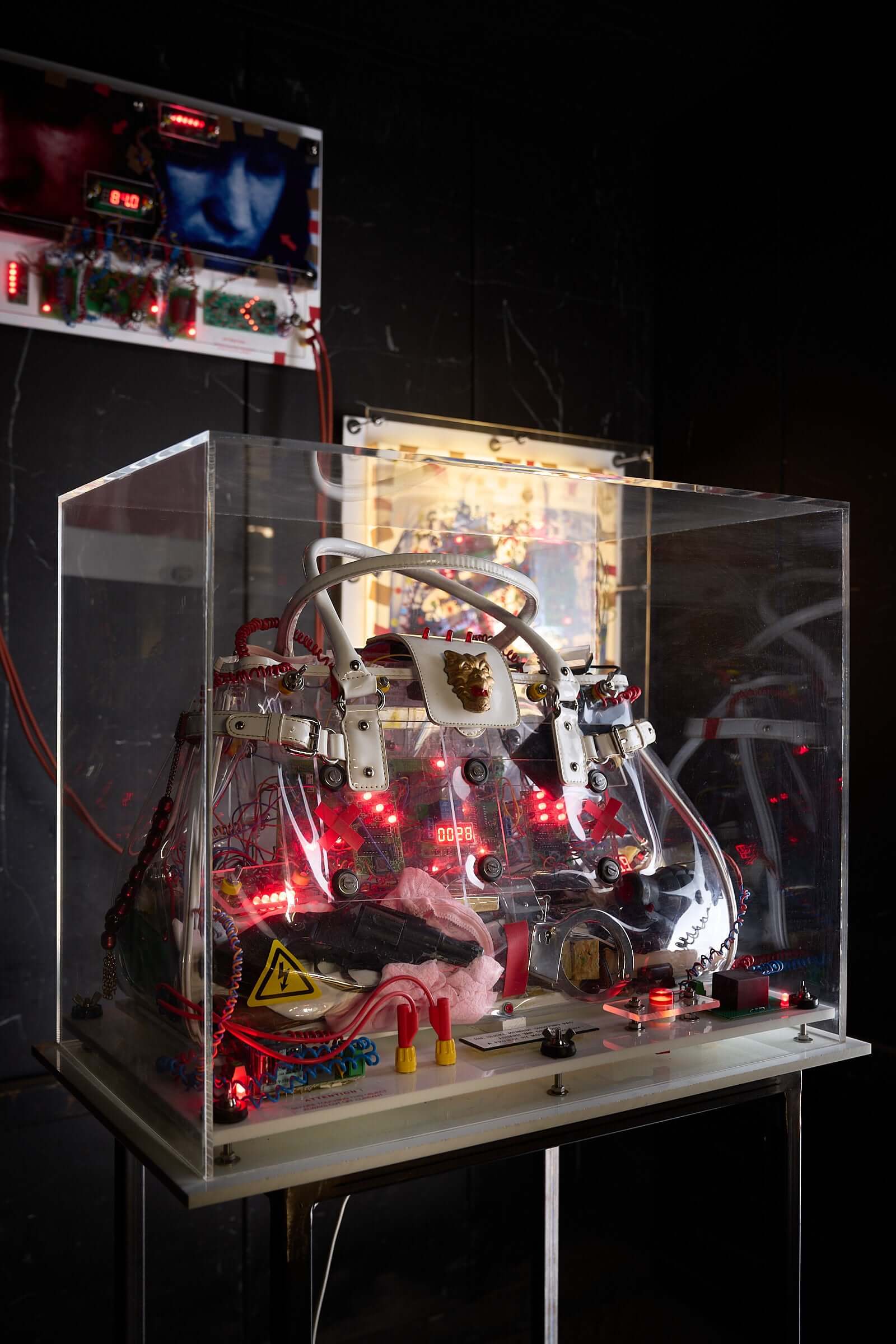 The Ulrike Meinhof Shopping Bag Installation by Eduard Van Giel (2017) mixed-media sculpture with lights and electronics.