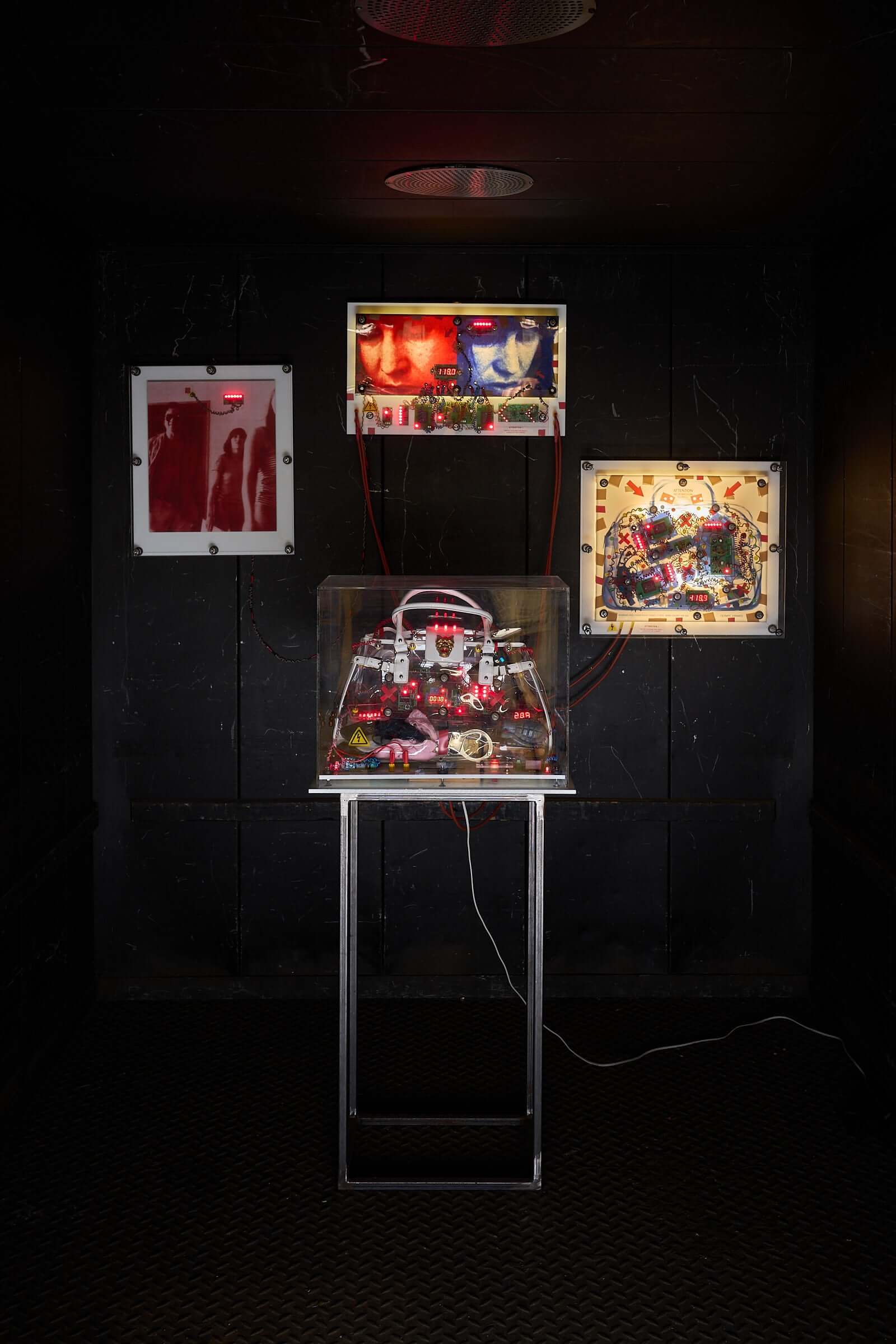 The Ulrike Meinhof Shopping Bag Installation by Eduard Van Giel (2017) featuring a mixed-media sculpture and wall panels.