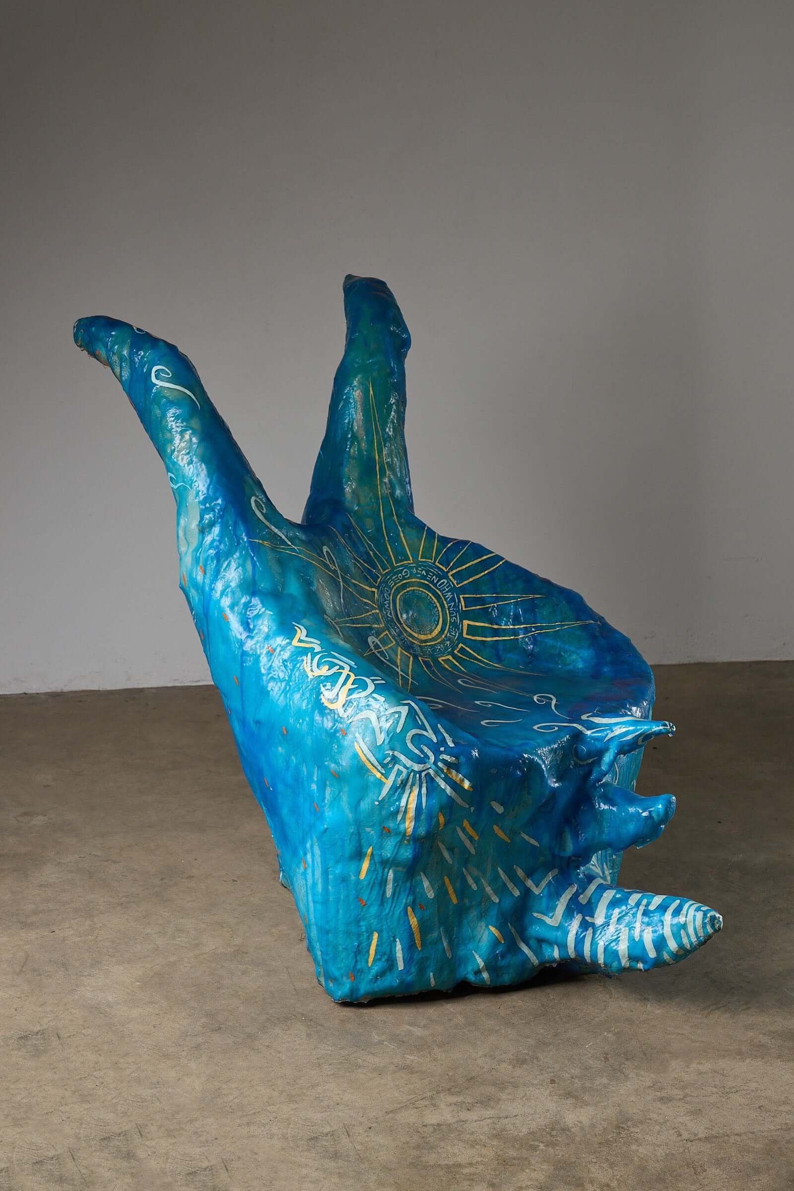 The Sun Who Never Goes Down Polyester Chair by Arne Quinze, 1971 in vibrant blue with sun motifs.