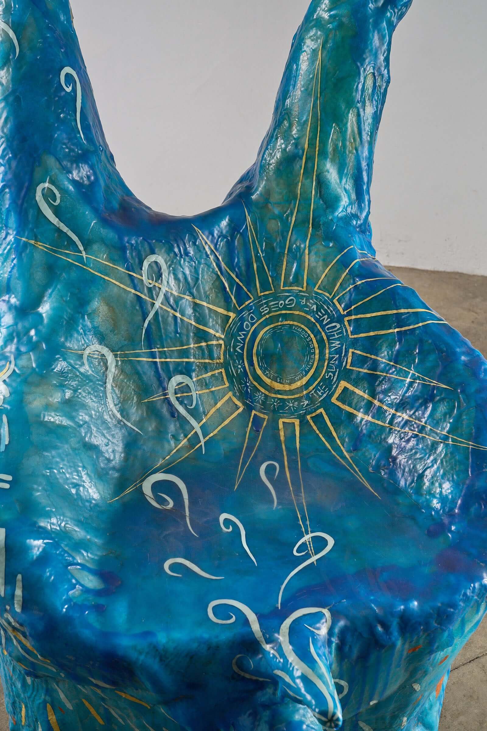 The Sun Who Never Goes Down Polyester Chair by Arne Quinze, 1971 in vibrant blue with gold accents and abstract designs.