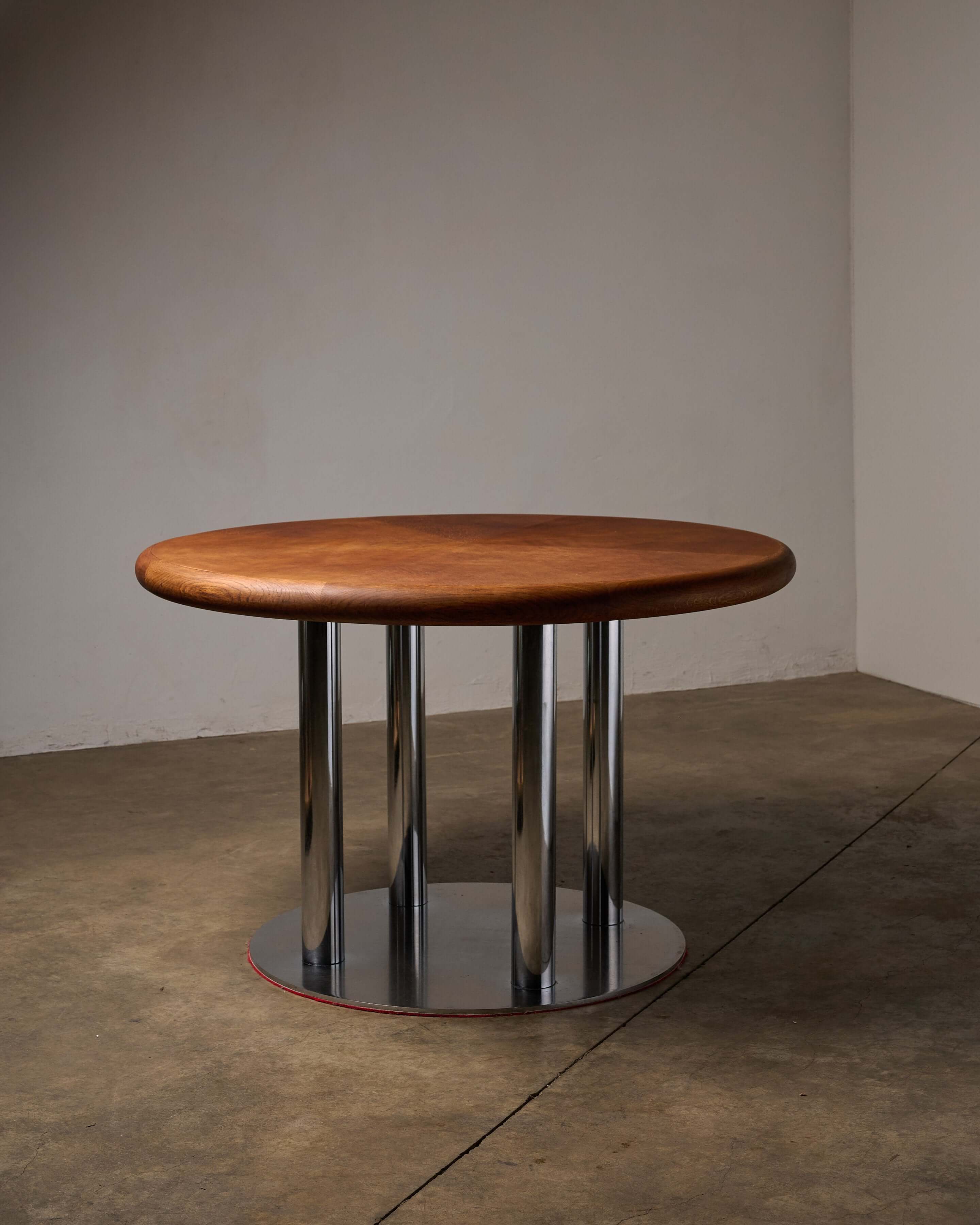 Round 1970s Dining Table with Chrome Pillar Base showcasing a sleek design with timber top and chrome base.