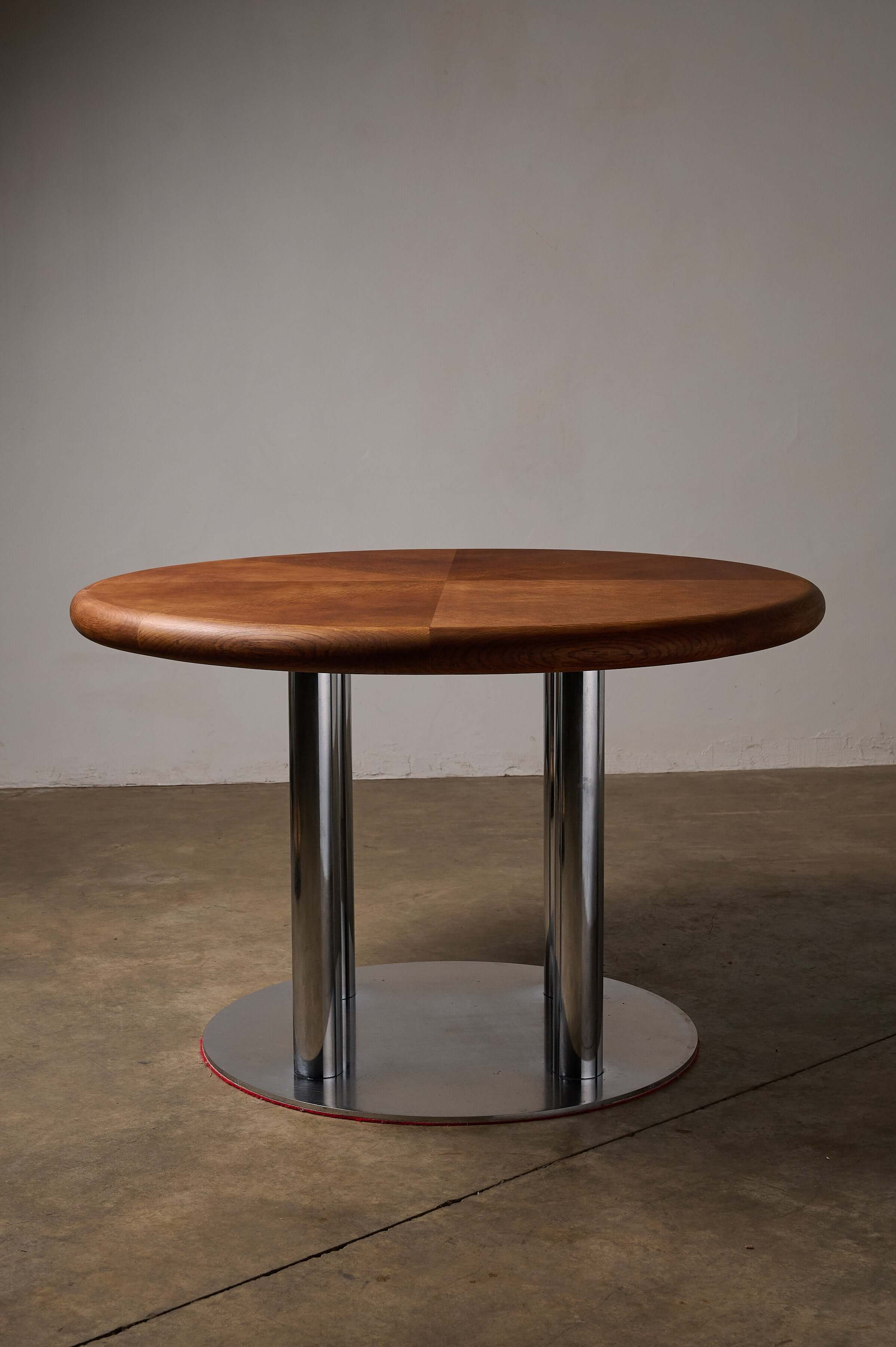 Round 1970s Dining Table with Chrome Pillar Base featuring a circular wood top and chrome base.