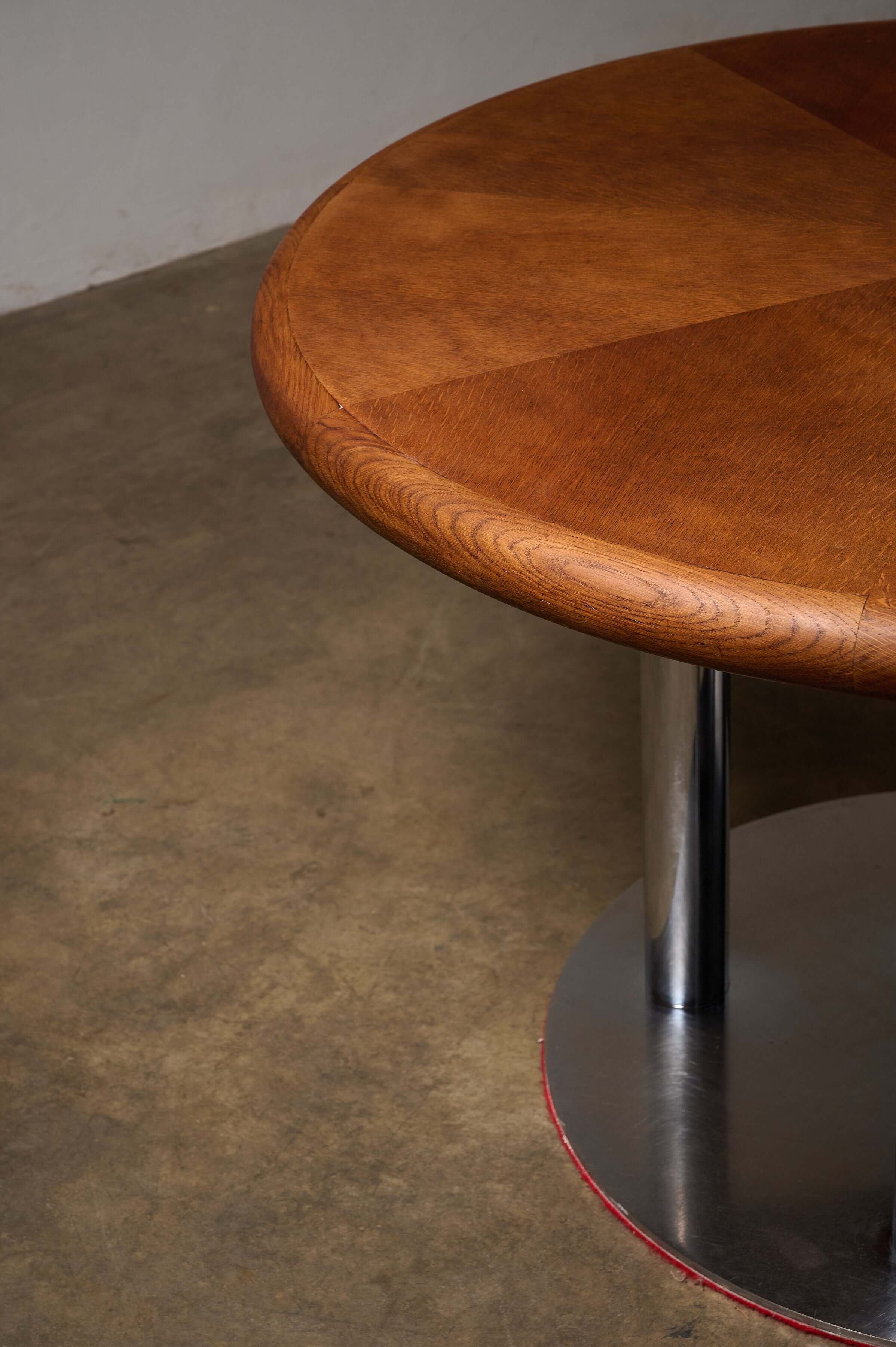 Round 1970s Dining Table with Chrome Pillar Base showcasing wood and chrome details.