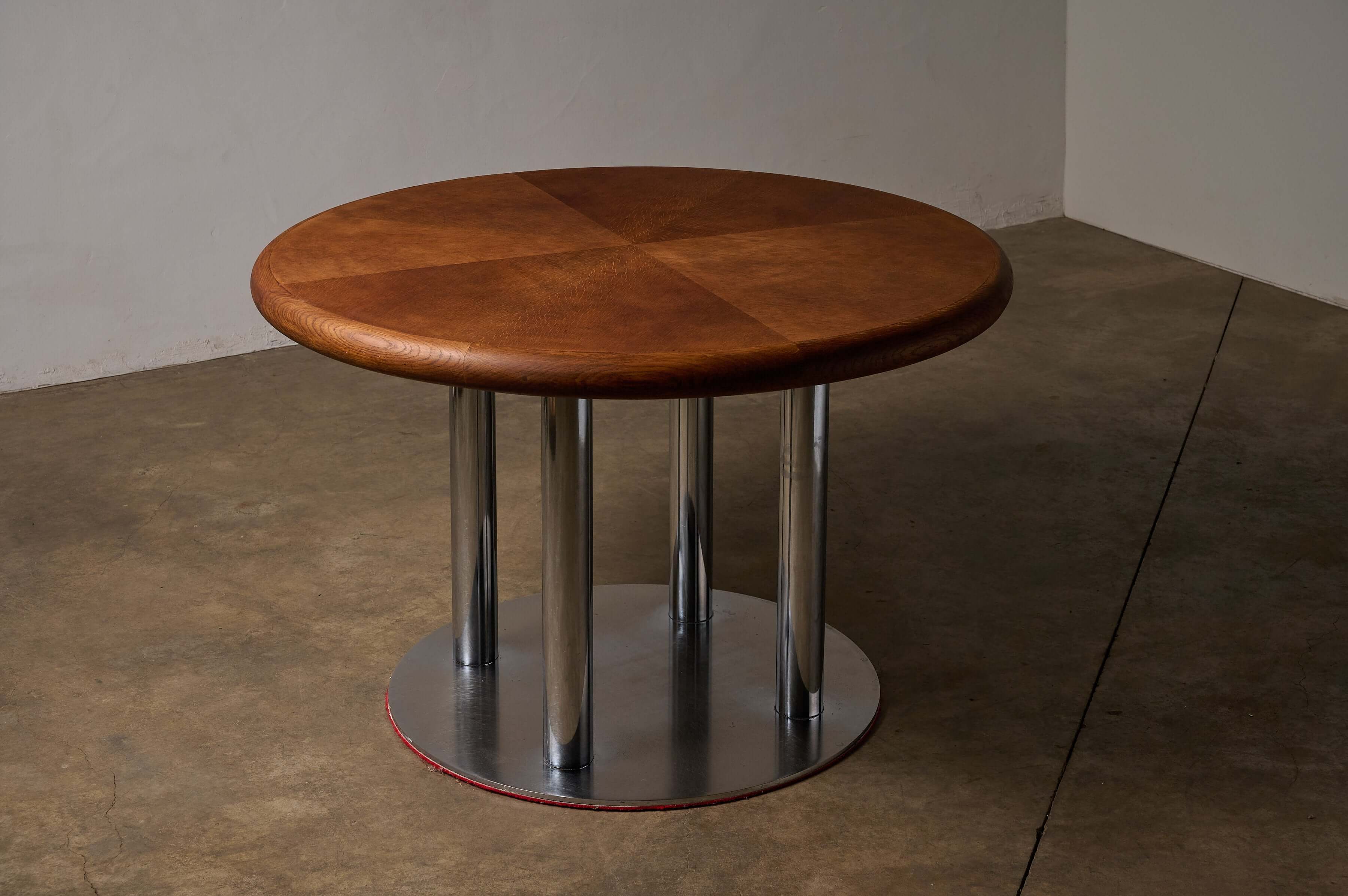 Round 1970s Dining Table with Chrome Pillar Base featuring a wooden top and chrome-plated cylinder base.