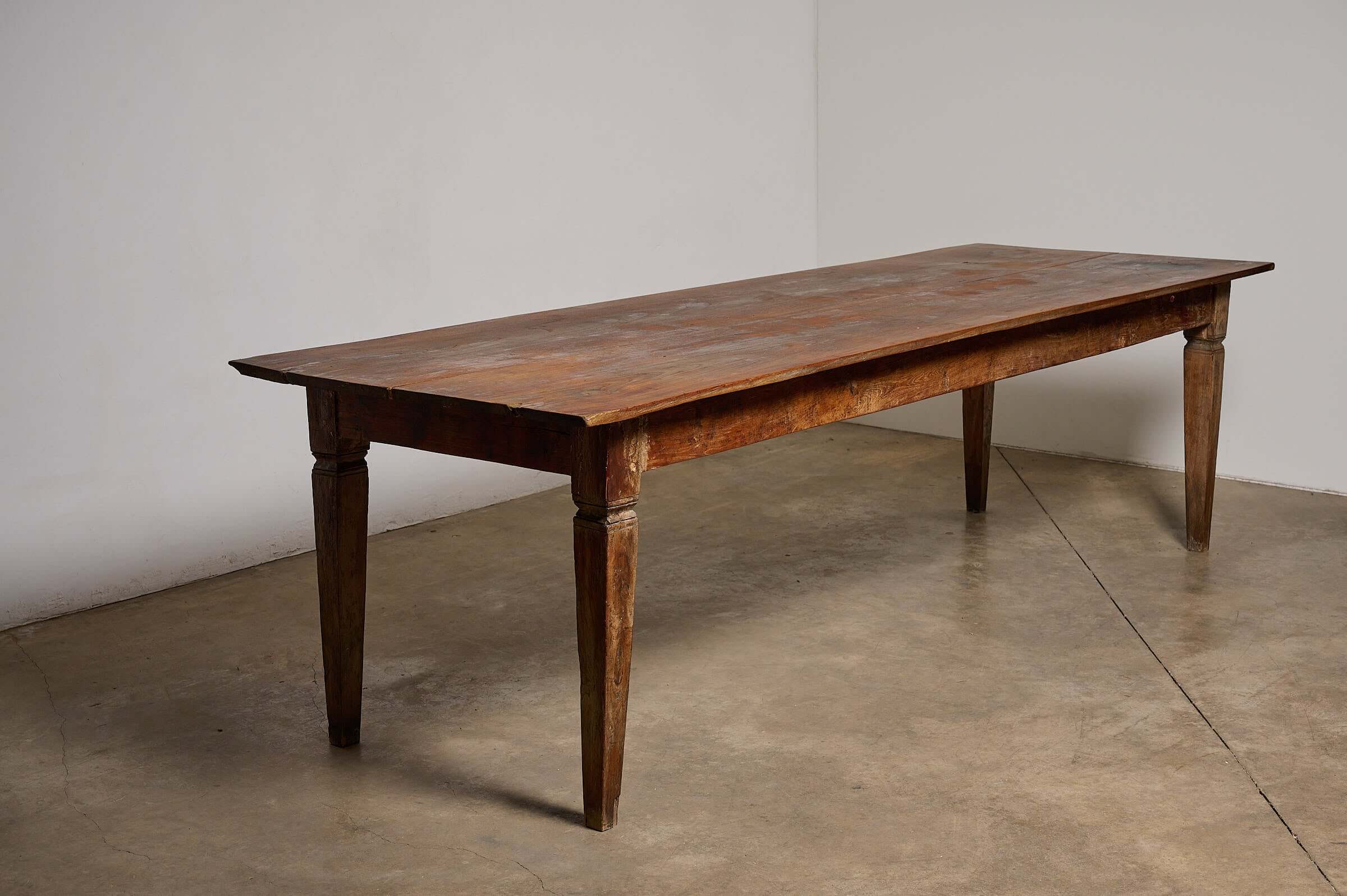 Antique French Farmhouse Table with a warm patina and sturdy tapered legs, showcasing beautiful wood grain.