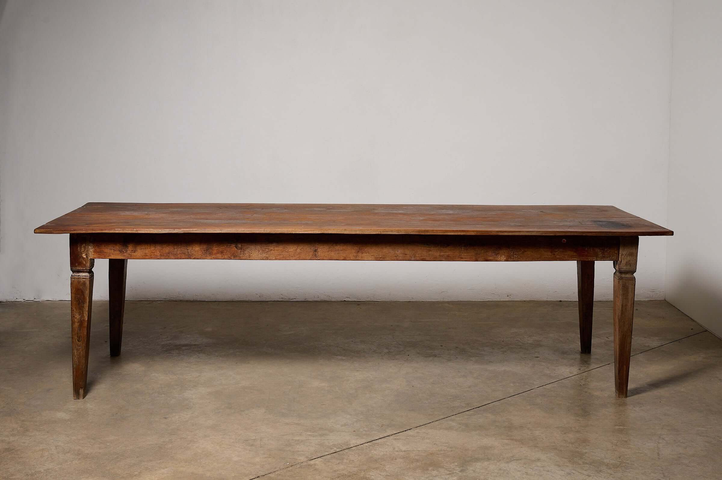 Antique French Farmhouse Table showcasing solid fruitwood construction and rich patina, ideal for rustic interiors.