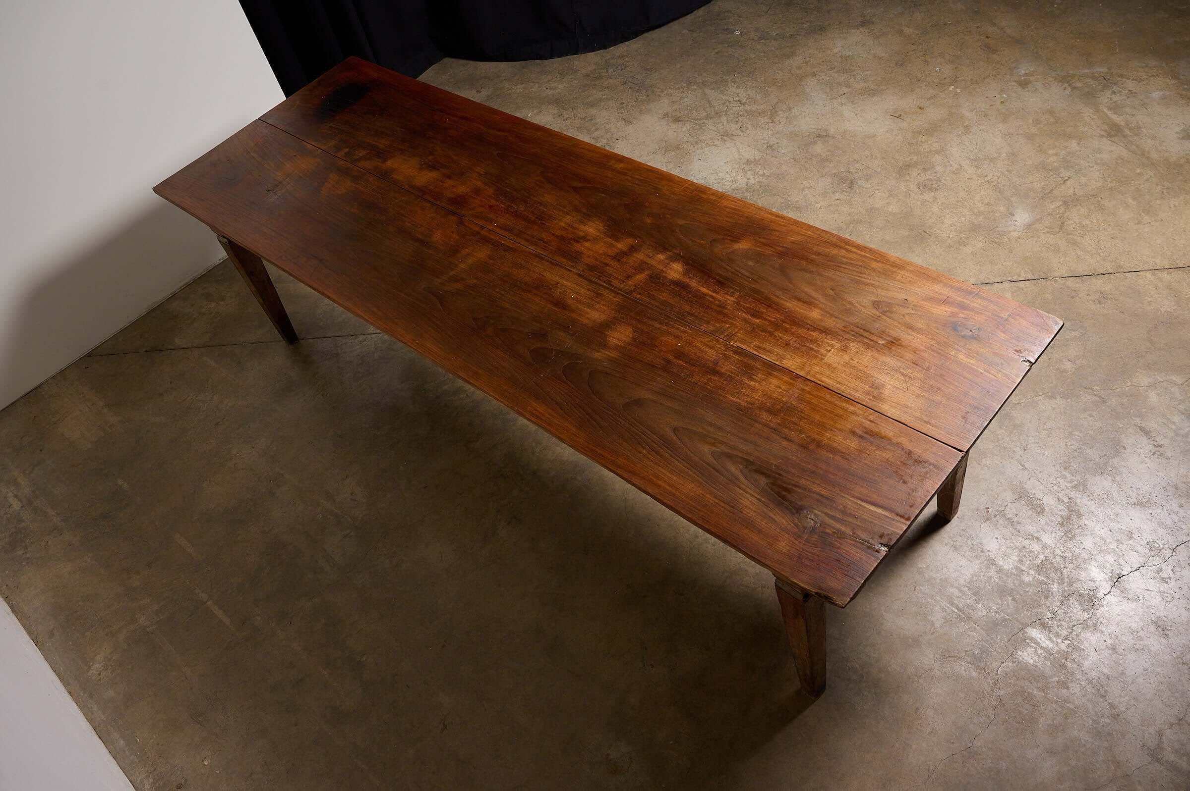 Antique French Farmhouse Table featuring a solid wood top with rich patina and tapered legs, ideal for rustic decor.