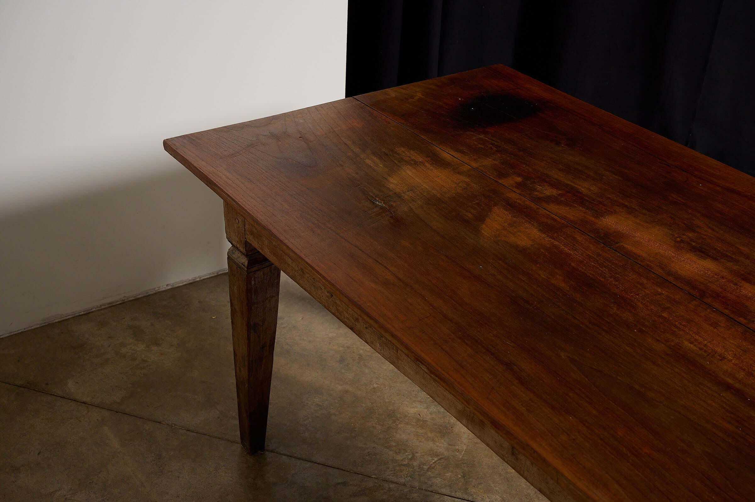 Antique French Farmhouse Table showing warm patina, solid fruitwood top, and tapered square legs.