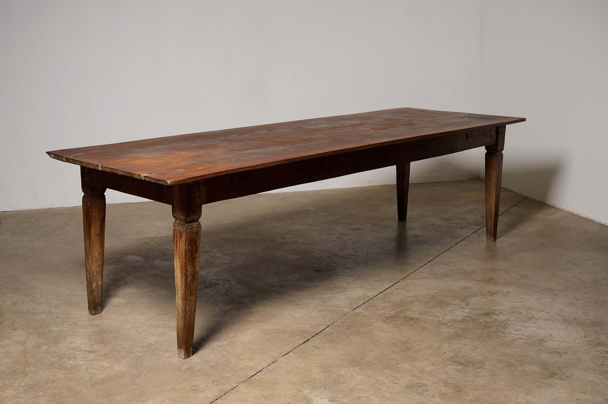 Antique French Farmhouse Table featuring solid wood construction and a rustic design.
