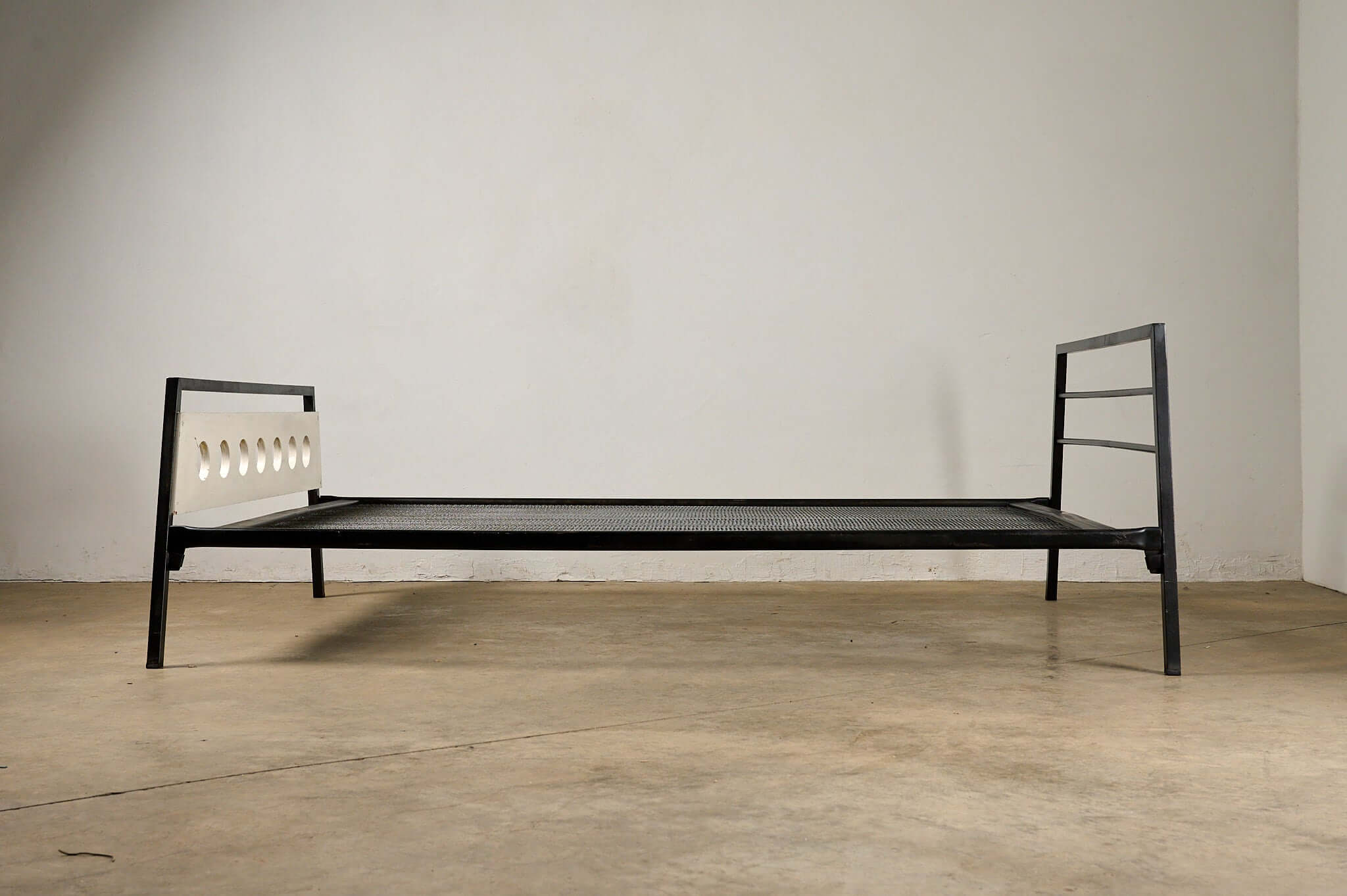 Rob Parry & Emile Truijen 'Kamer 56' Bed for Dico Dico with black metal frame and porthole cutouts.