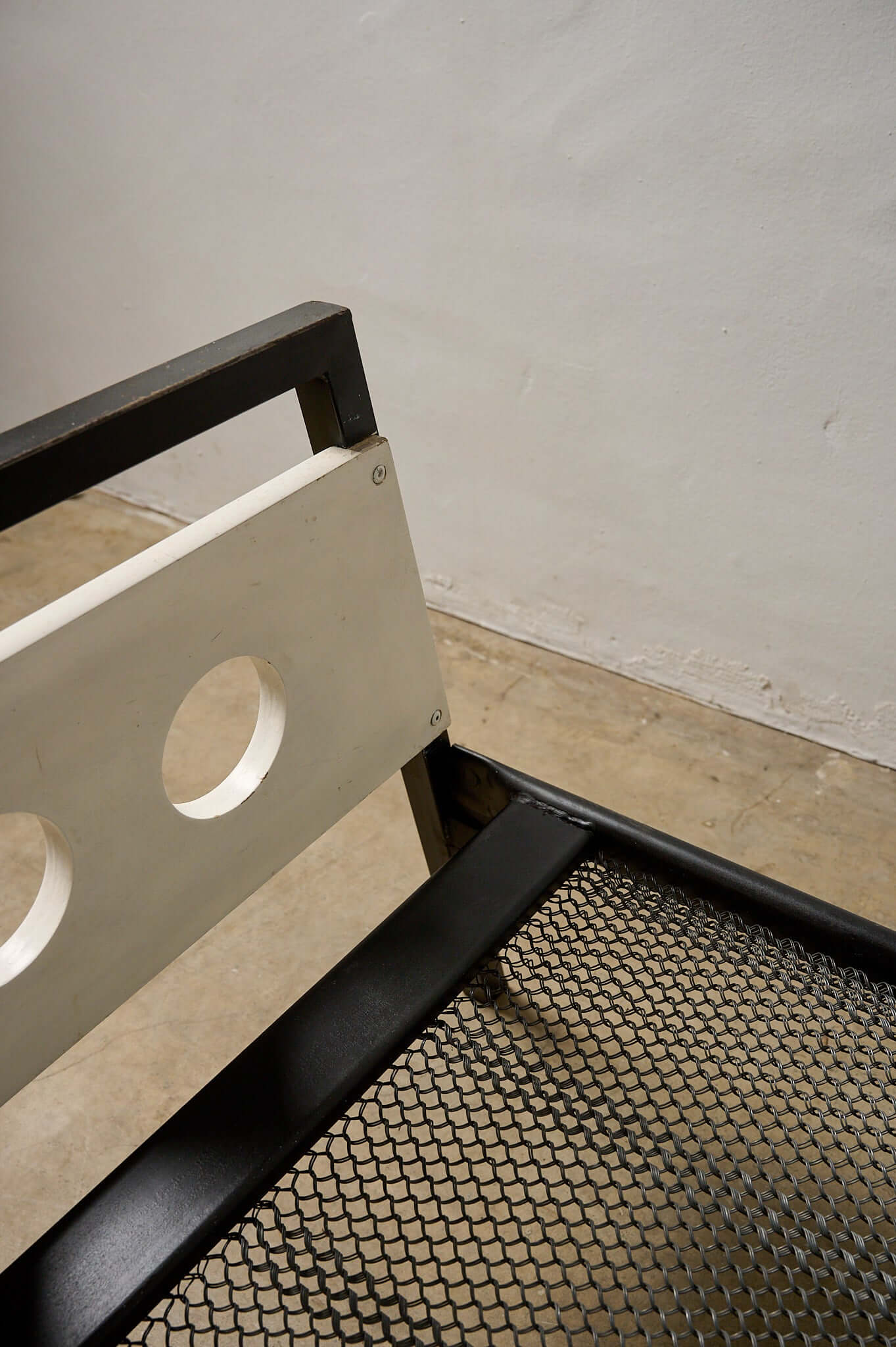 Rob Parry & Emile Truijen 'Kamer 56' Bed for Dico Dico close-up of footboard detail with circular cutouts.