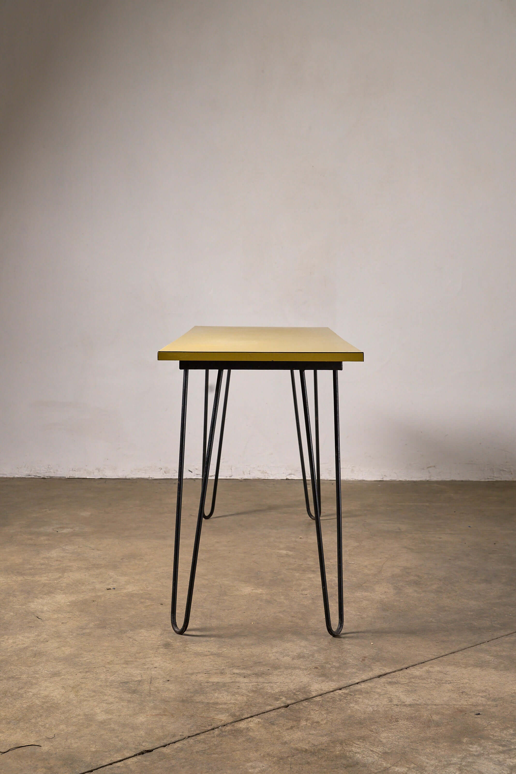 Mid-Century Yellow Console or Desk featuring textured yellow laminate and black metal hairpin legs.