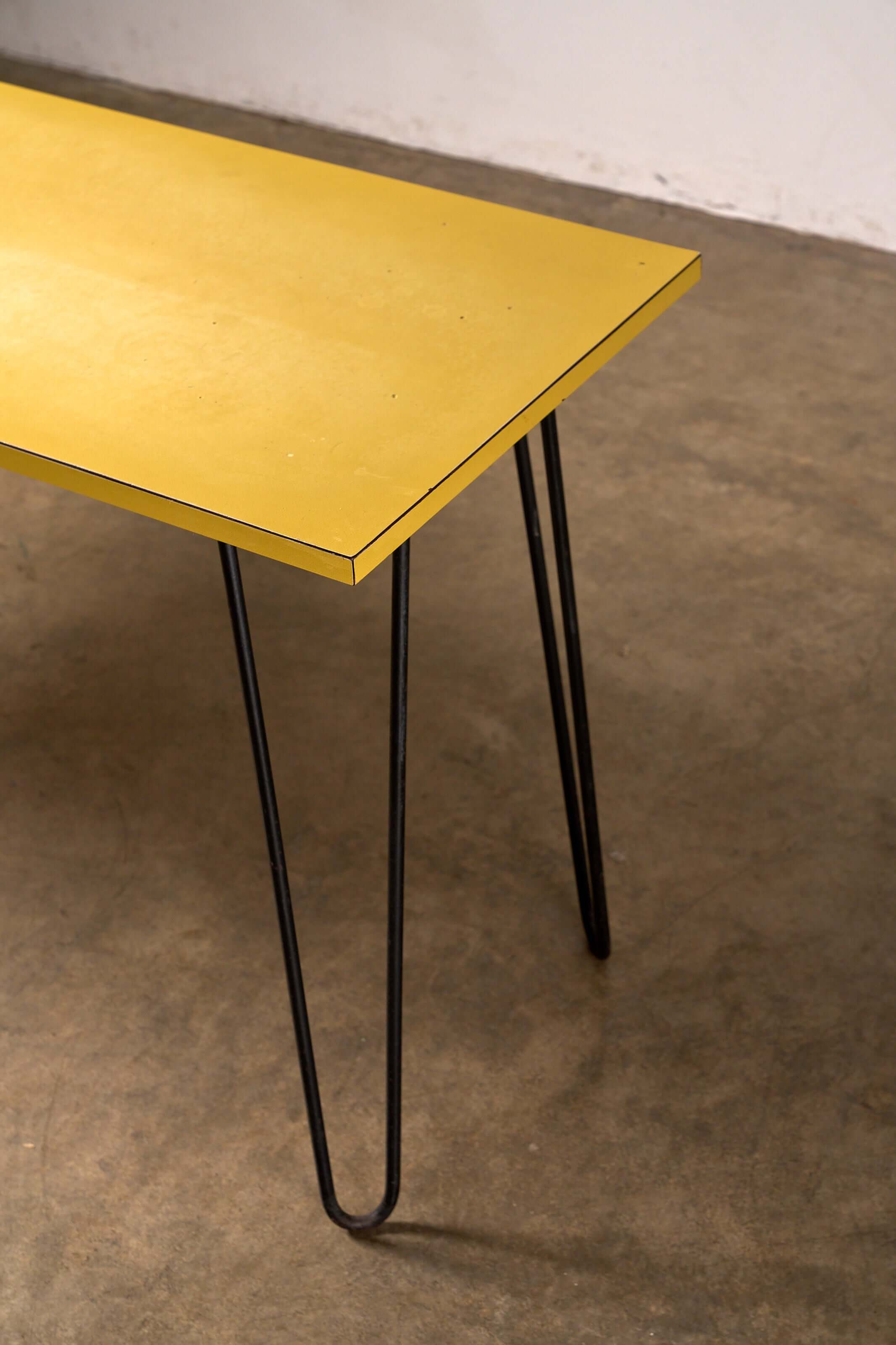 Mid-Century Yellow Console or Desk featuring a textured yellow laminate top with black metal hairpin legs.