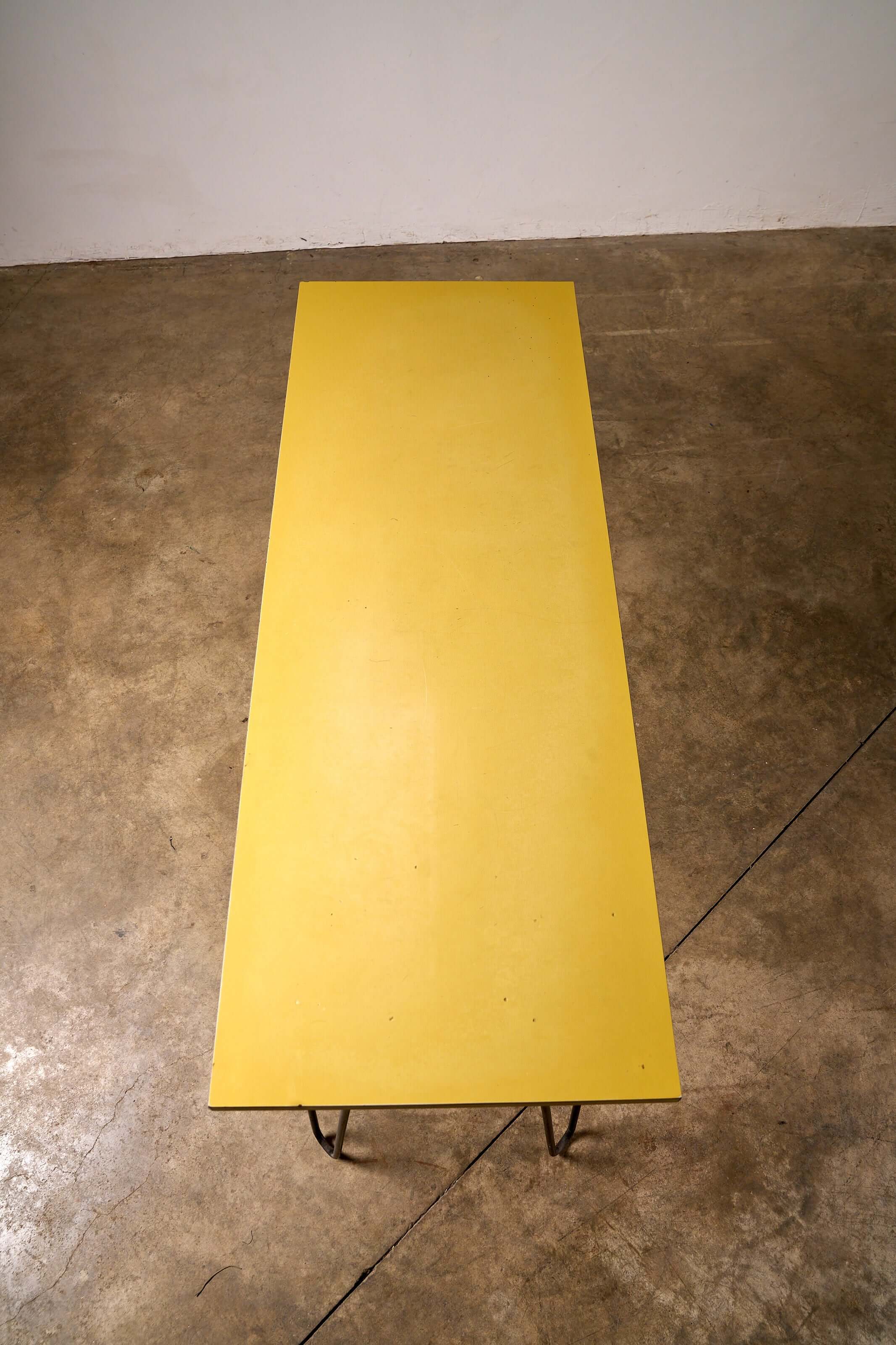 Mid-Century Yellow Console or Desk with textured yellow laminate top and black metal hairpin legs.