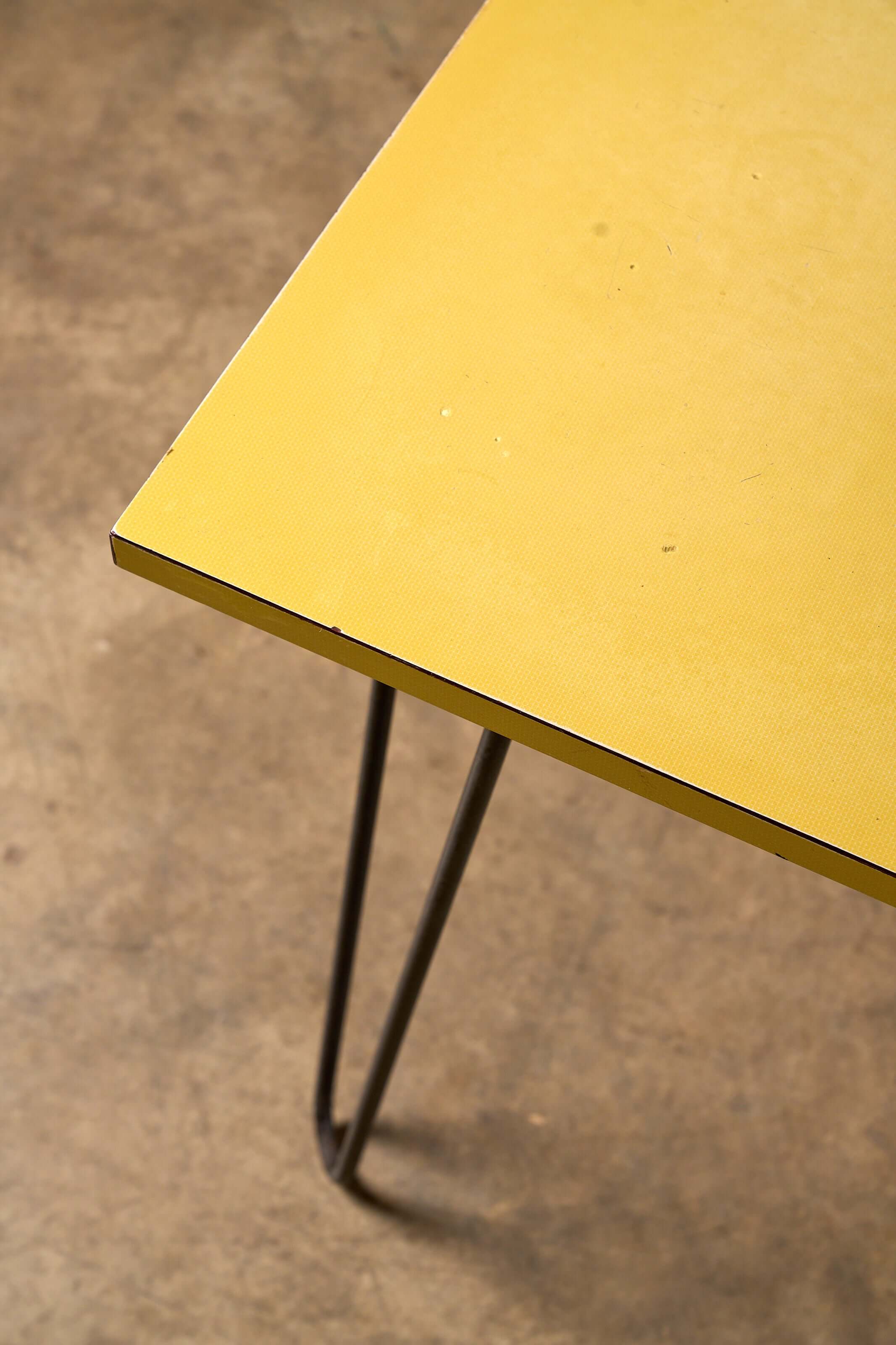 Mid-Century Yellow Console or Desk with textured yellow laminate top and black metal hairpin legs.