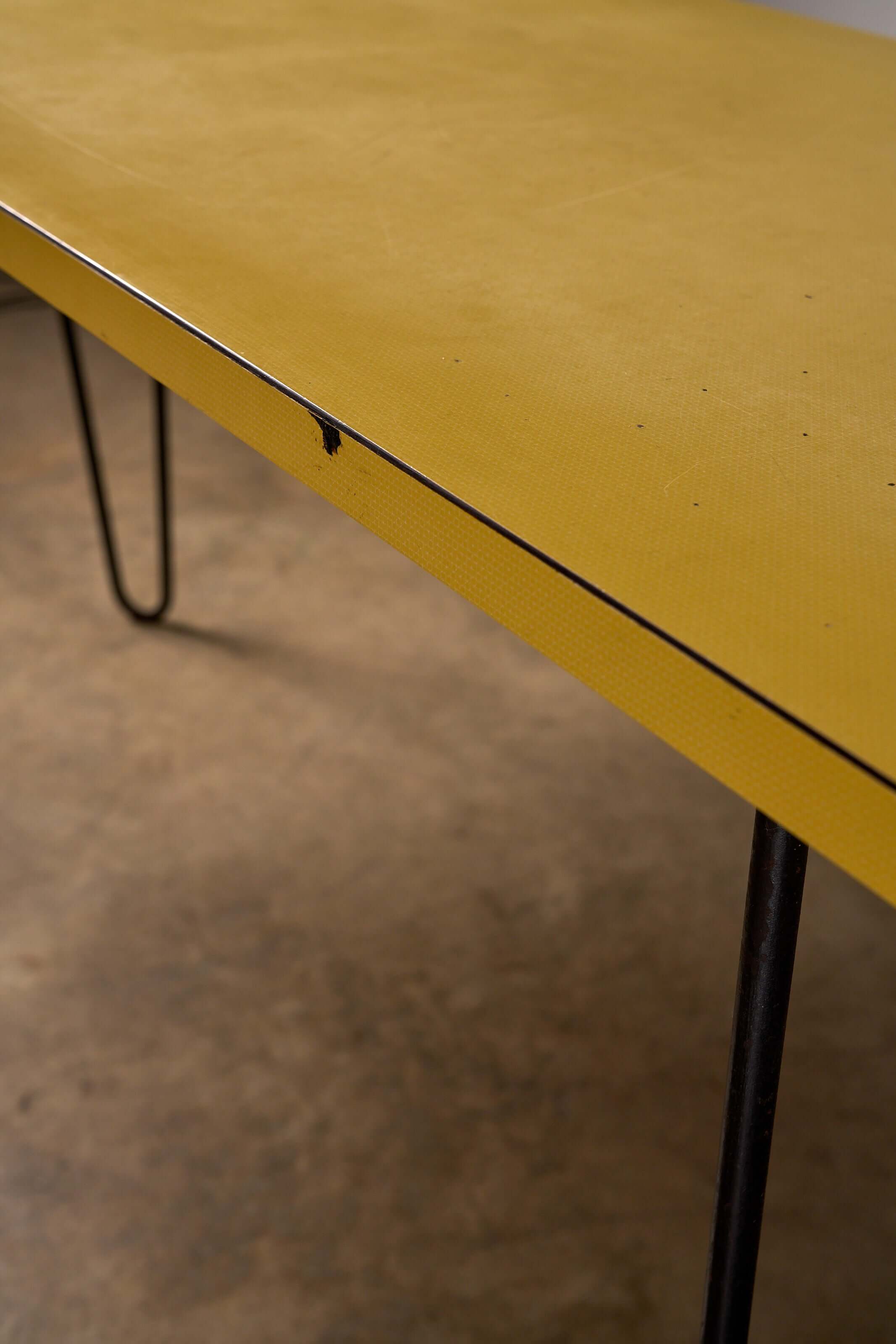 Mid-Century Yellow Console or Desk featuring textured yellow laminate top and black metal hairpin legs.
