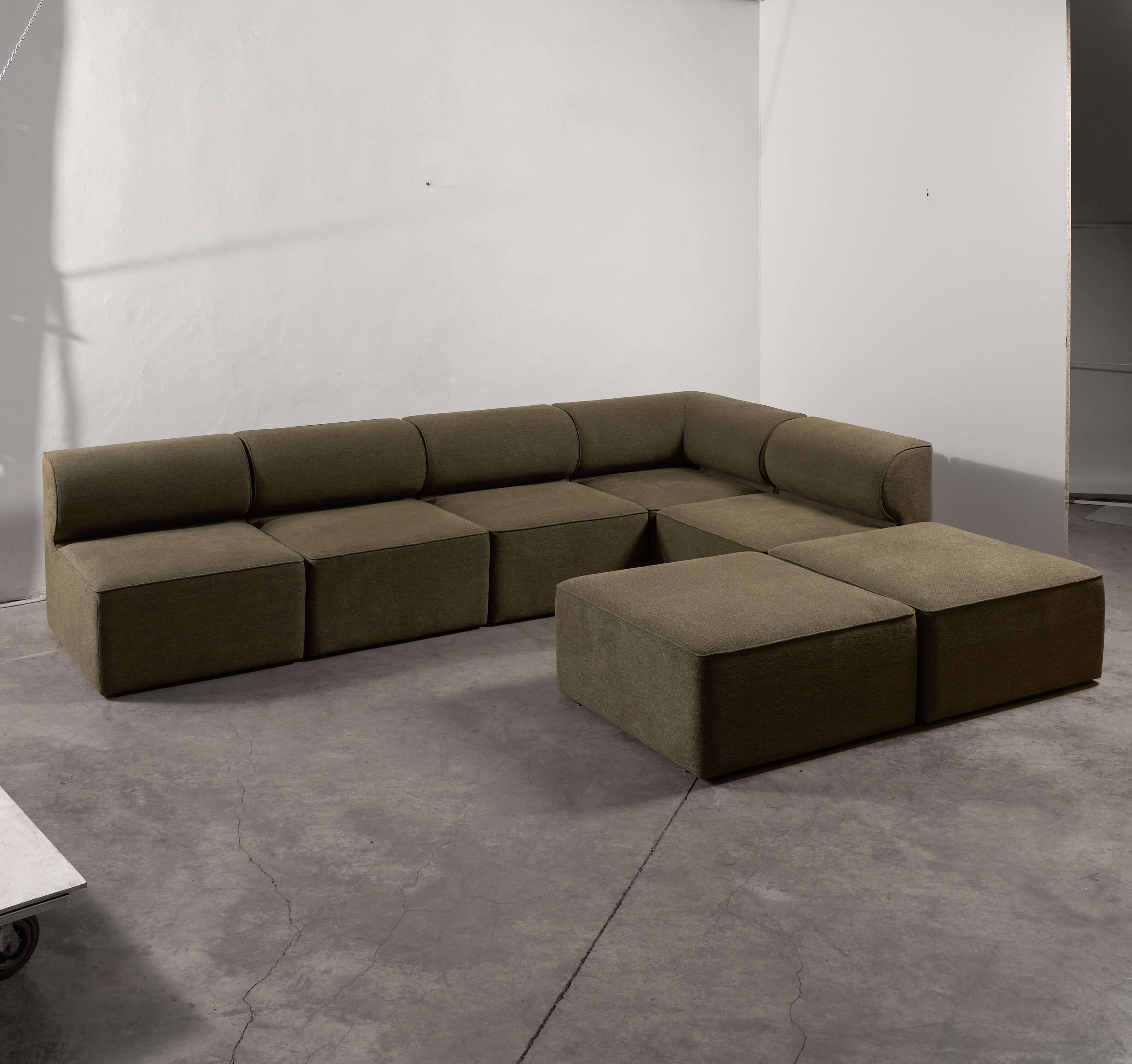 Eave Modular Sofa by Norm Architects in Grey Green showcasing distinct curved profile and generous proportions.