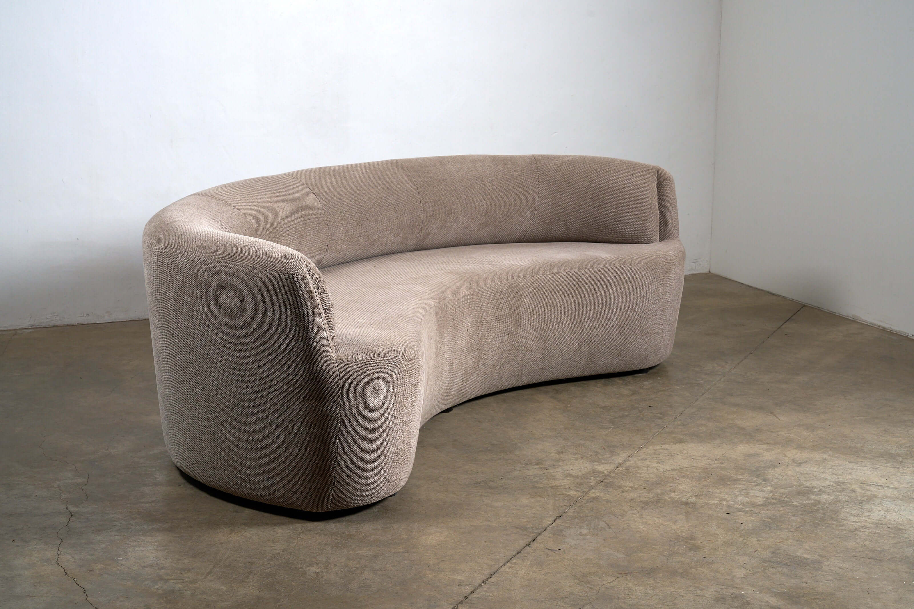 Organic Modern Curved Fabric Sofa in textured beige upholstery with a sculptural curved design.