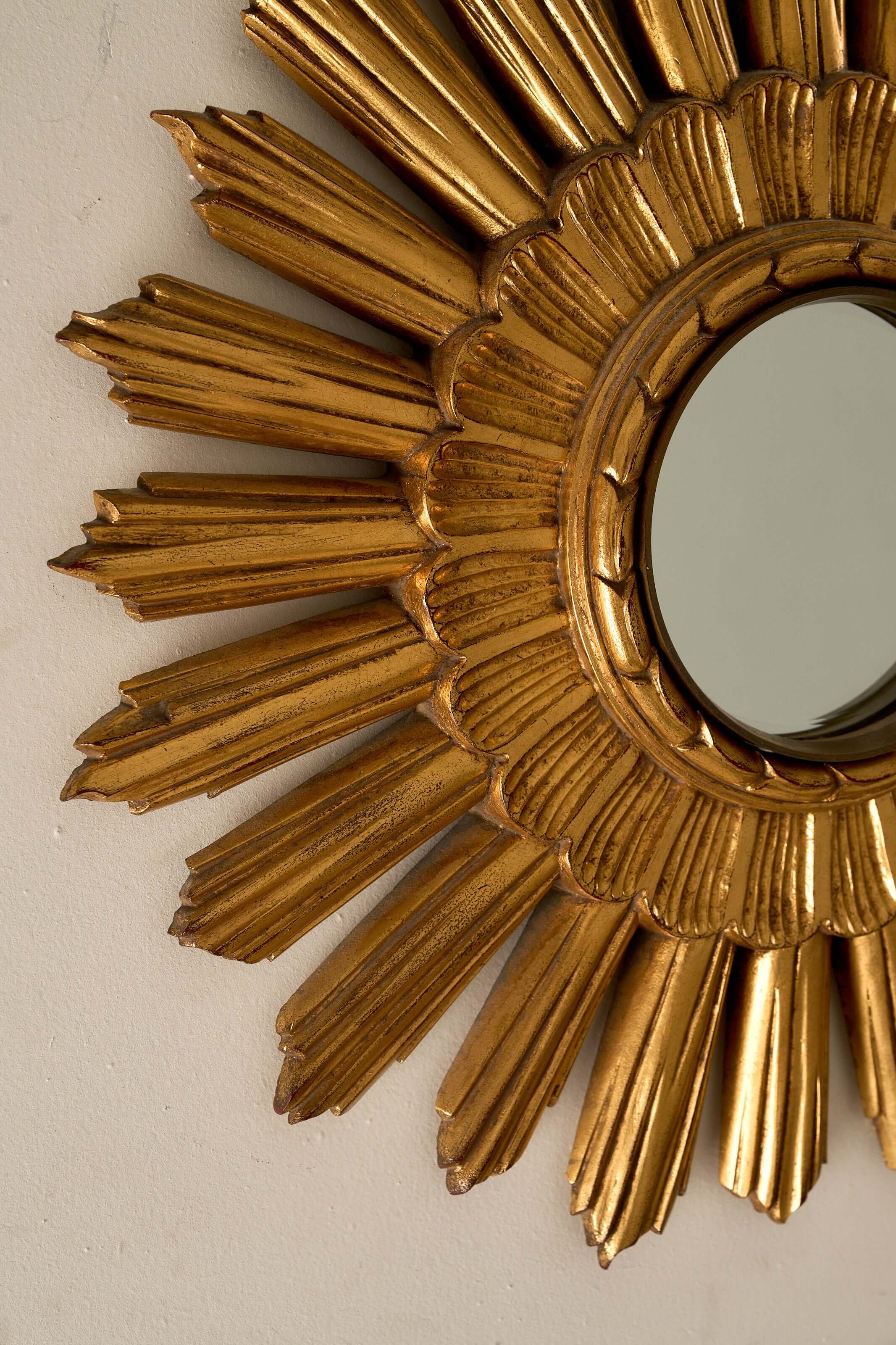 Mid-Century Plaster Sunburst Mirror, 1960s with a gilded frame and layered starburst design.
