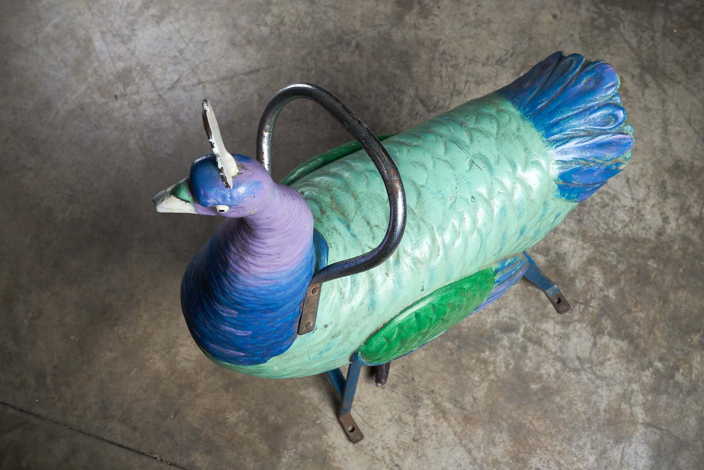 Antique Carnival Ride Peacock Sculpture, hand-carved wooden figure with colorful painted finishes and metal support.
