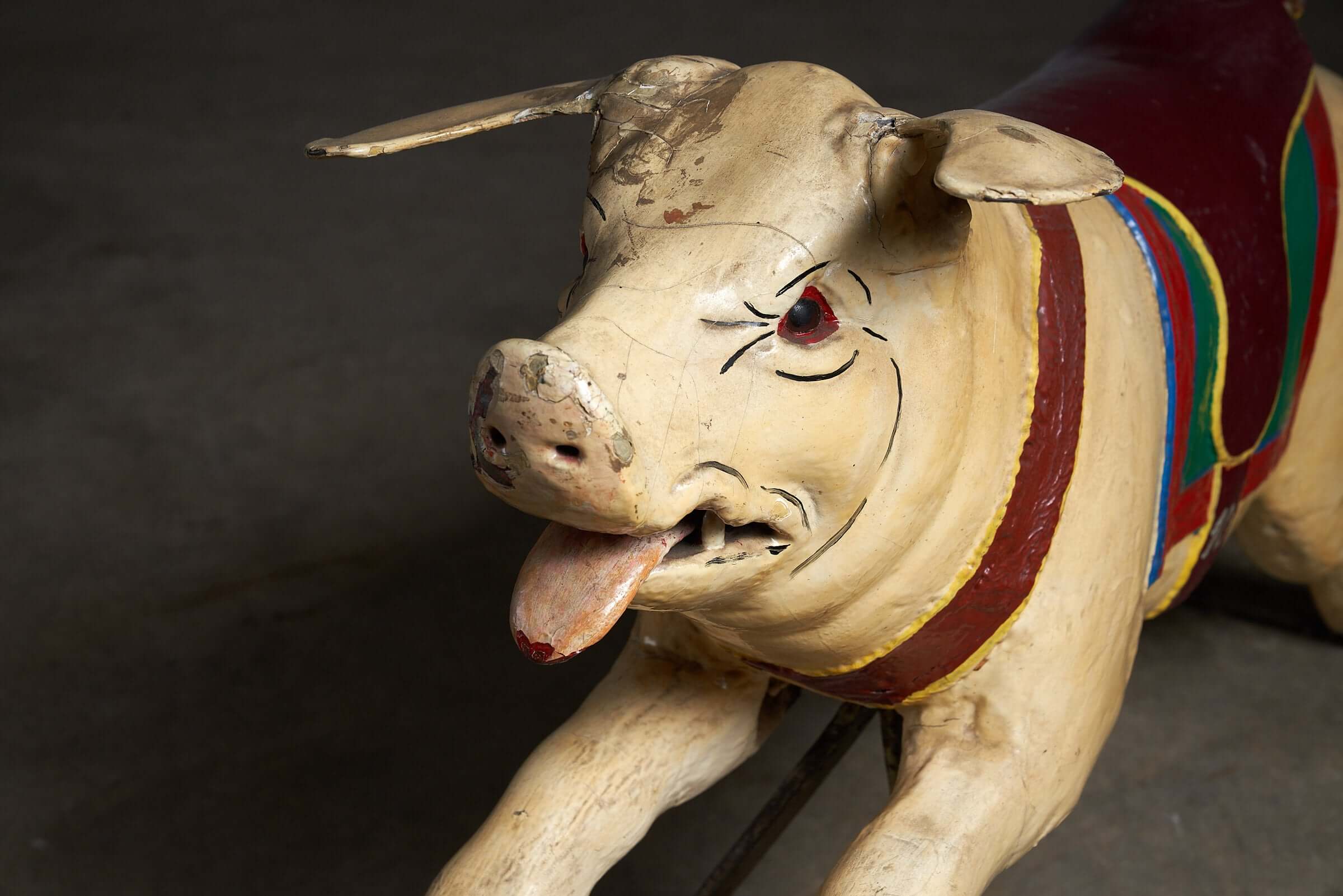 Carved Wooden Carousel Pig Figure featuring a painted saddle and curled iron tail, showcased in good vintage condition.