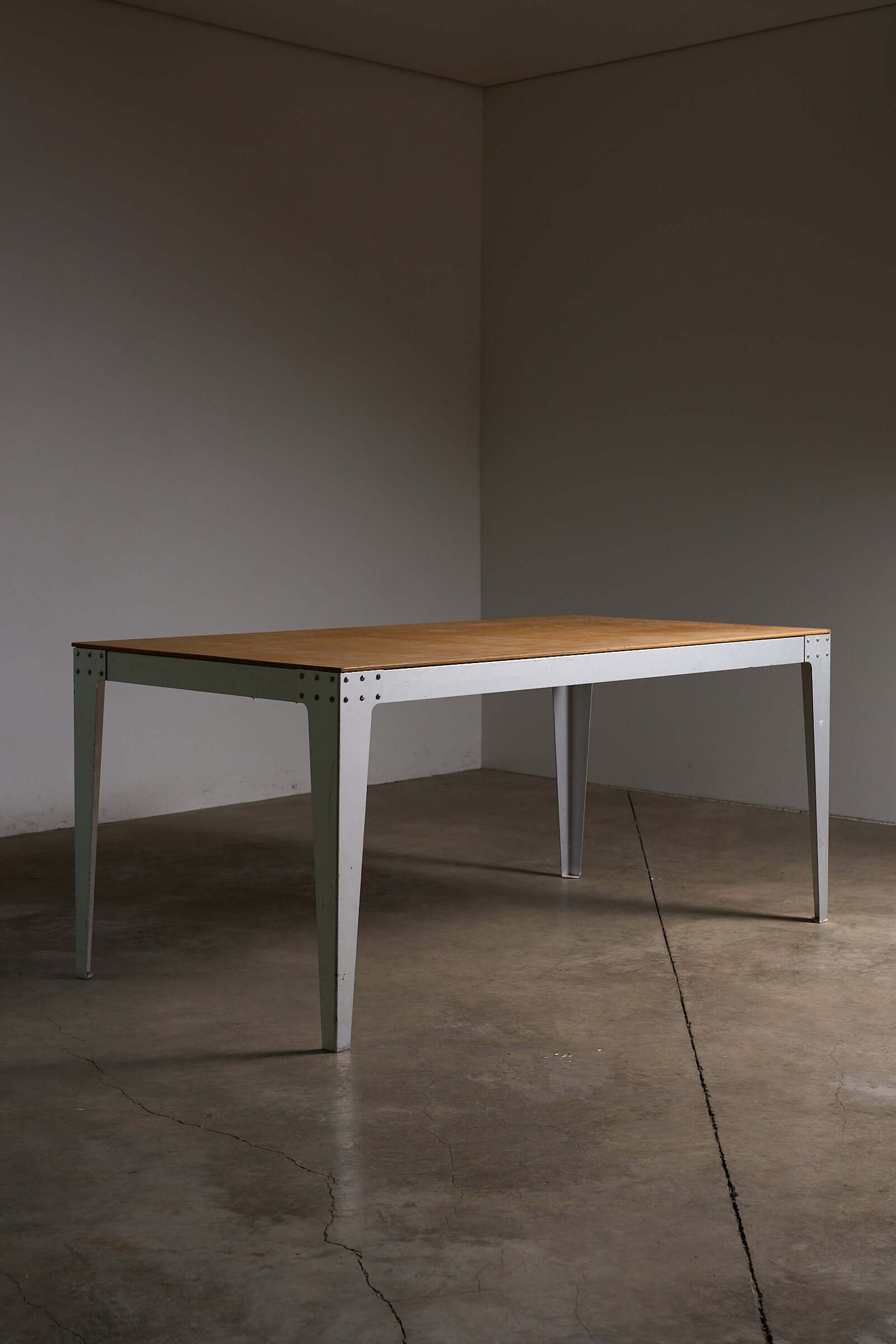 Piet Hein Eek Industrial Aluminium and Plywood Dining Table showcasing a minimalist design with plywood top and metal base.