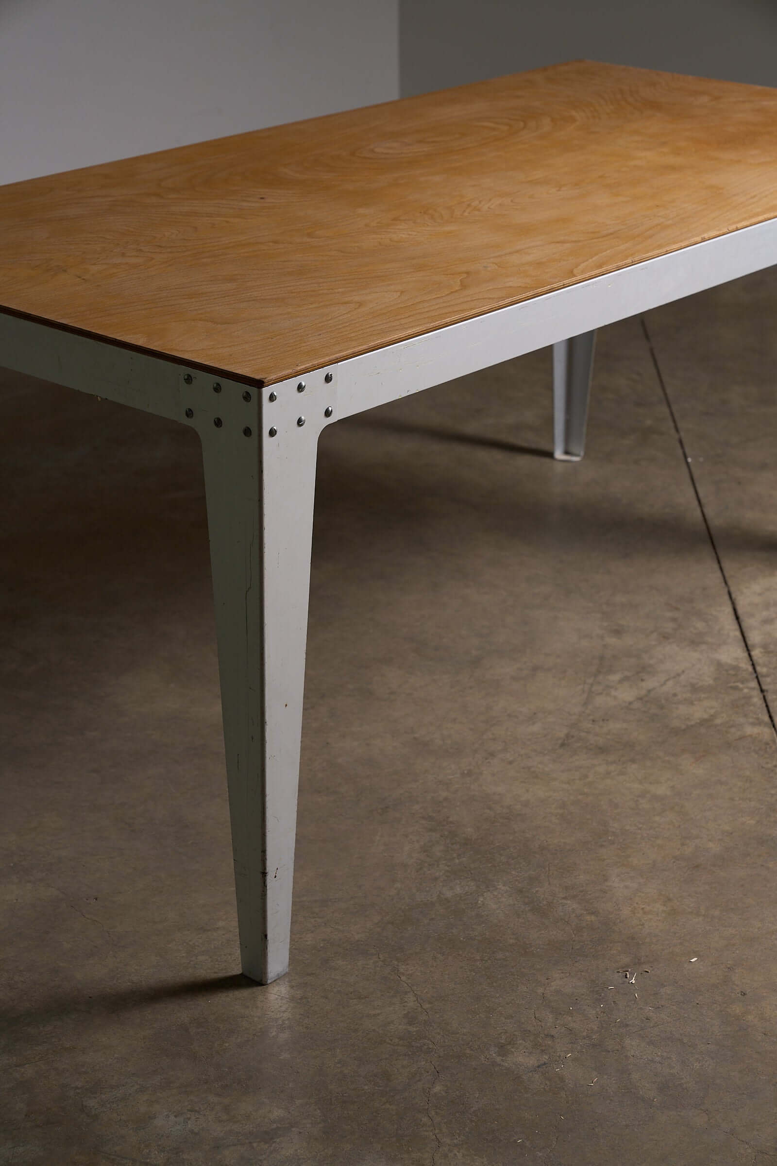 Piet Hein Eek Industrial Aluminium and Plywood Dining Table showcasing plywood top and folded metal legs.