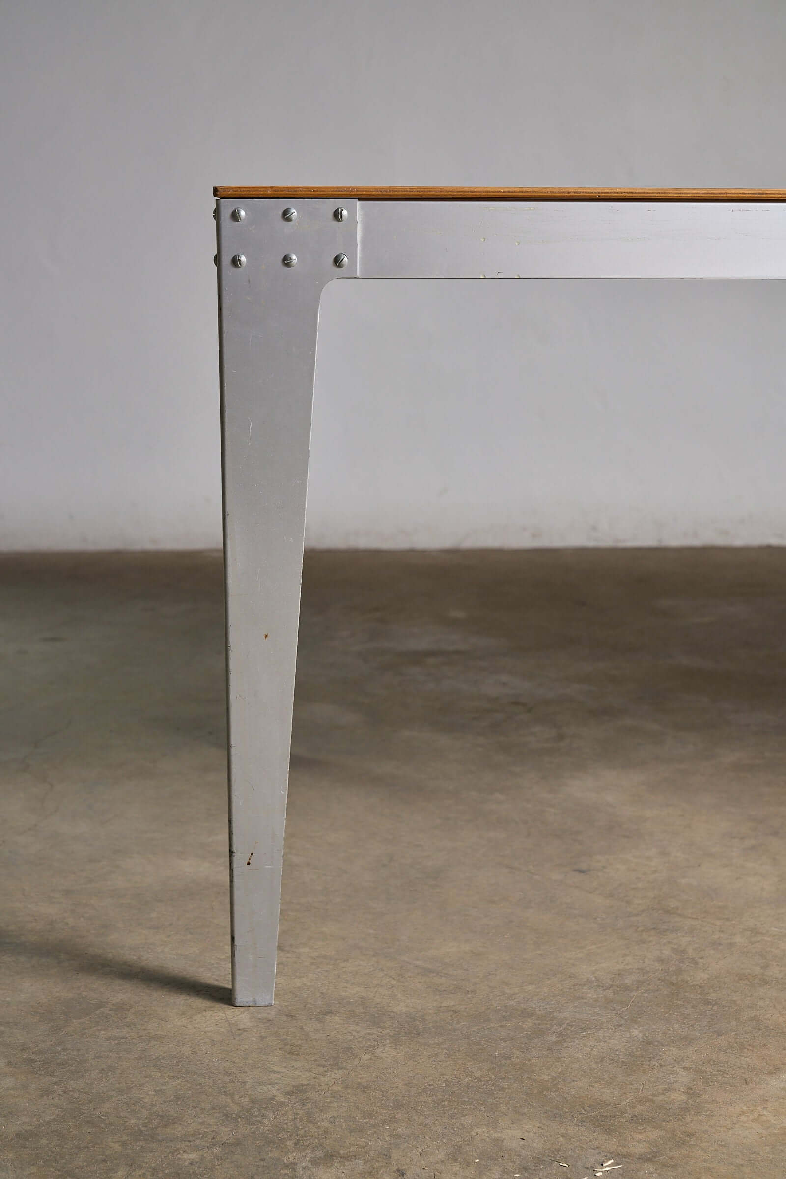 Piet Hein Eek Industrial Aluminium and Plywood Dining Table leg with industrial bolts and tapered design.