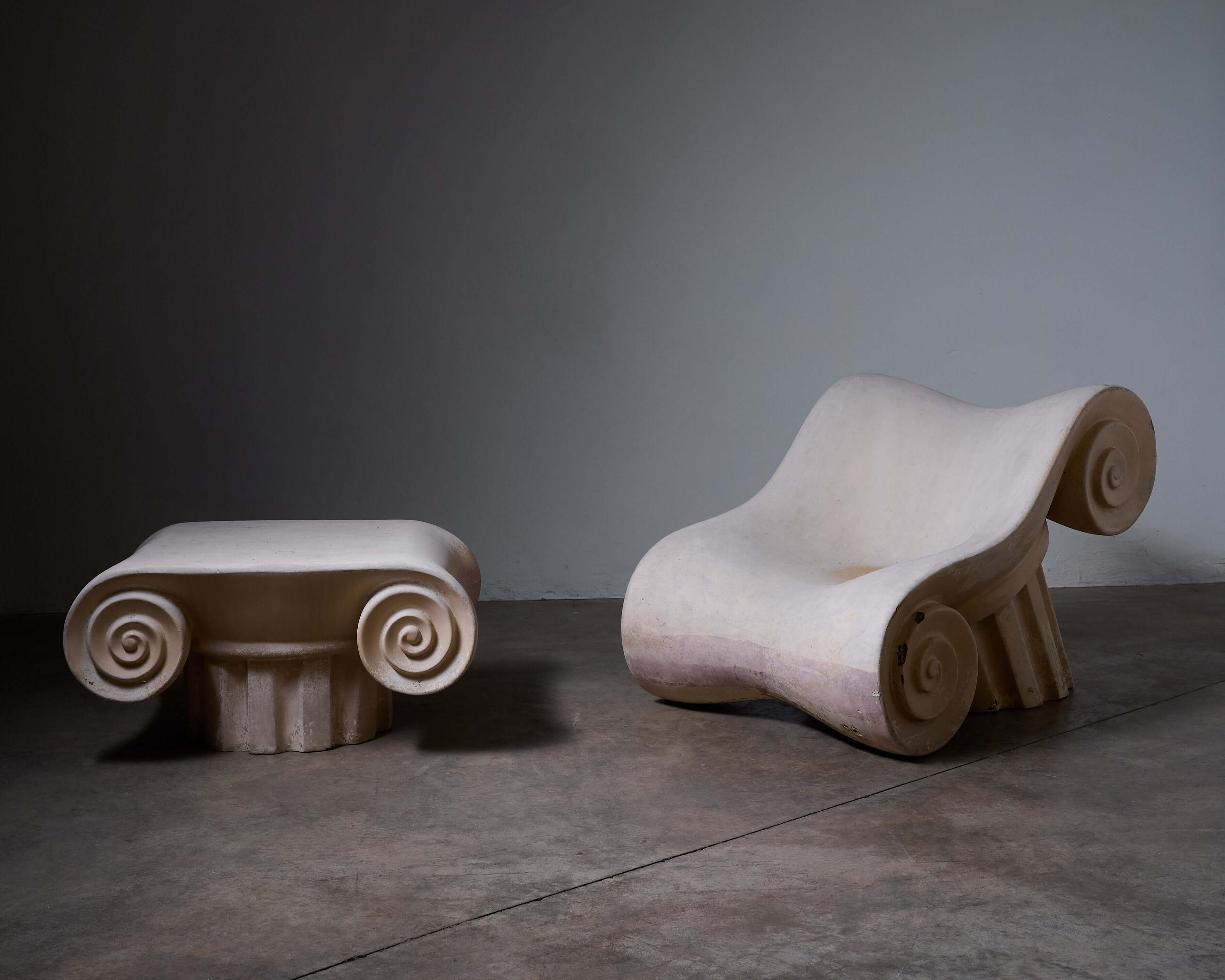 Capitello Chair with Ottoman styled like ancient Greek columns, showcasing unique design and comfort in modern decor.