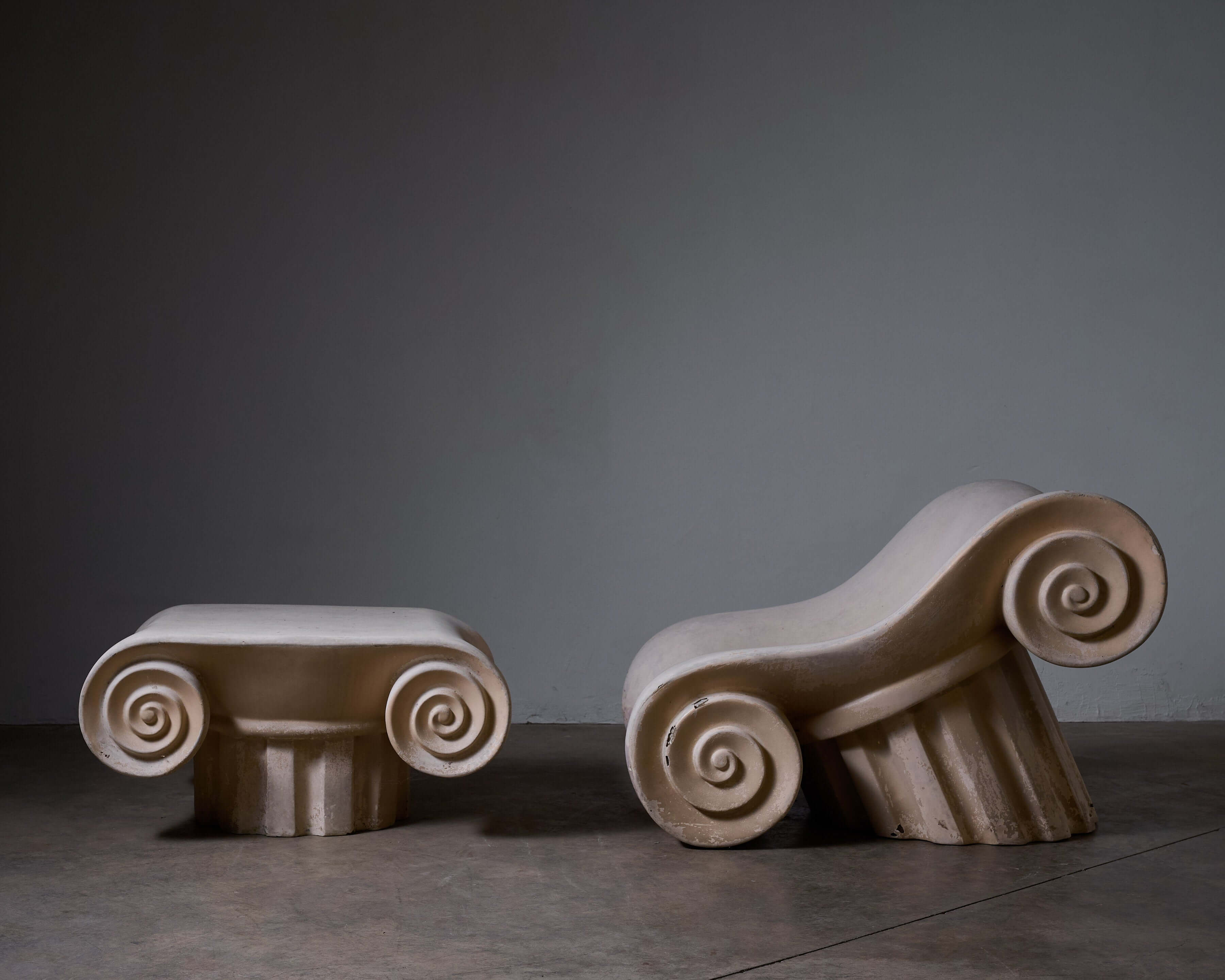 Stylish 'Capitello' Chair with Ottoman showcasing elegant design inspired by ancient architecture.