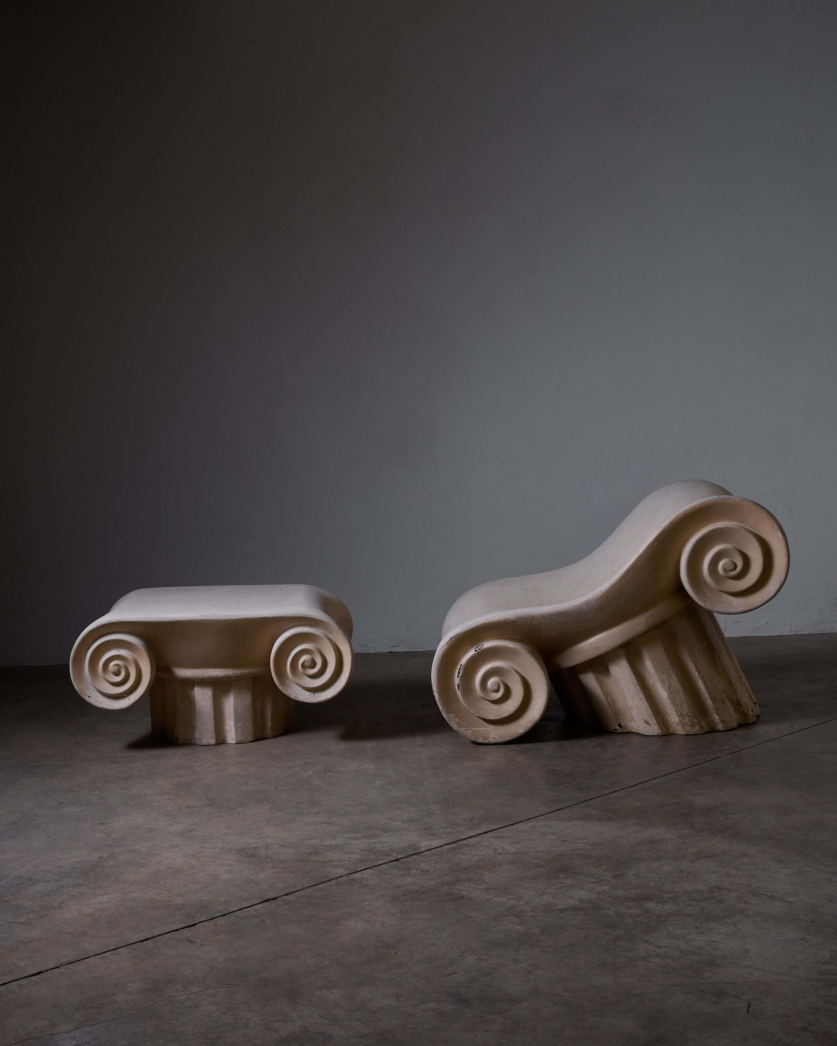 Capitello Chair with Ottoman designed by Studio 65, showcasing unique archaeological-inspired forms.