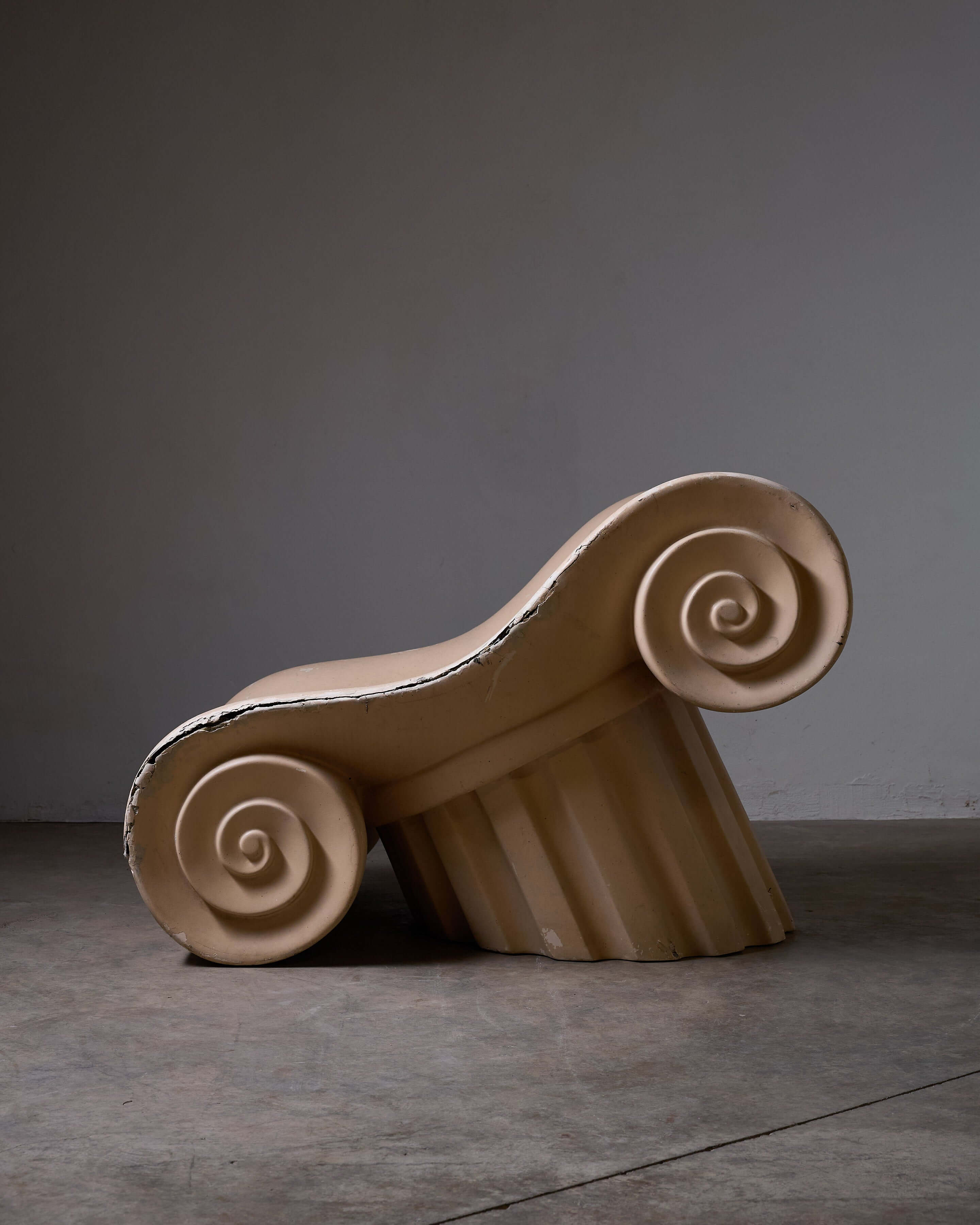 Capitello chair design inspired by ancient Greek architecture, emphasizing comfort and style.