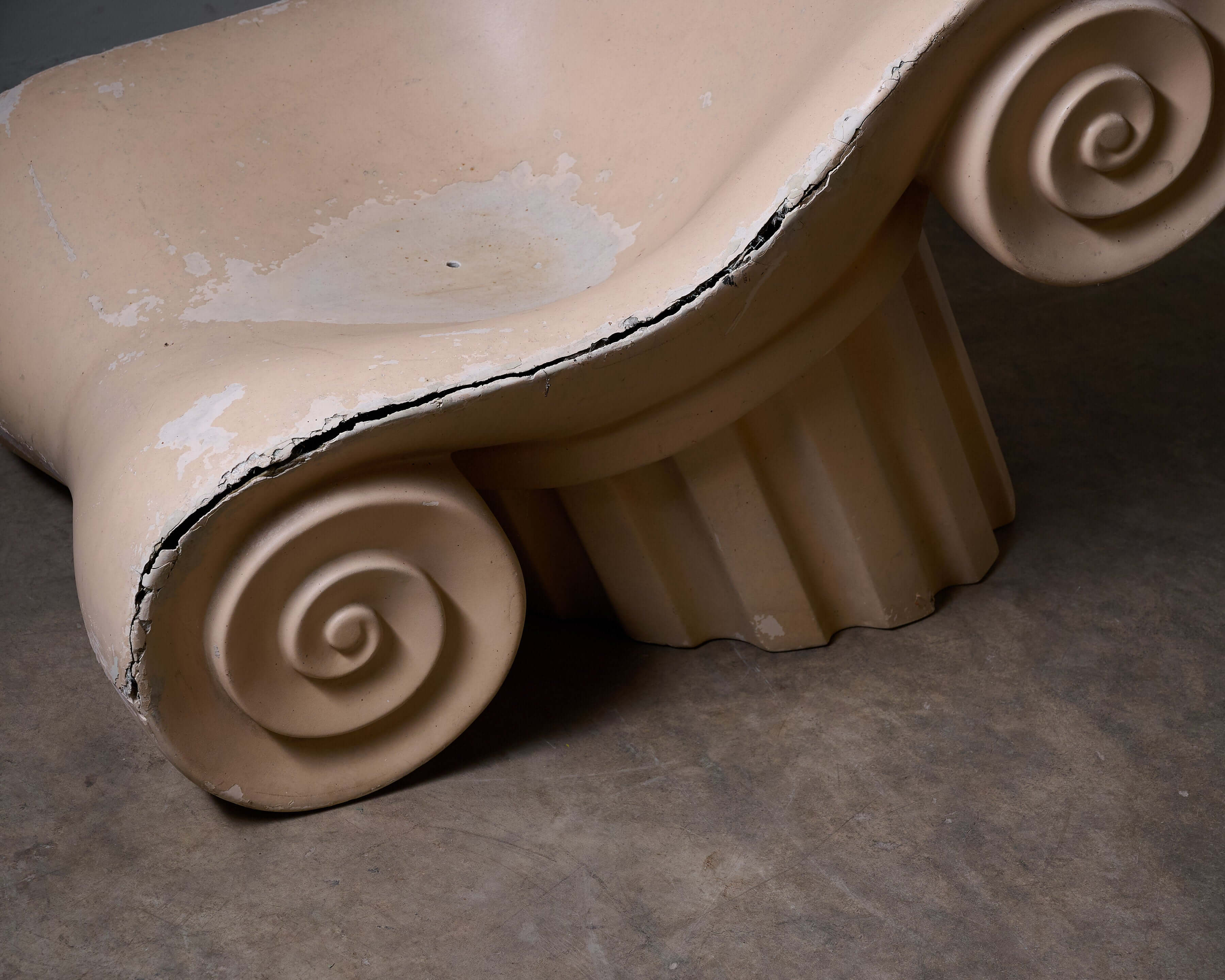 Close-up of 'Capitello' Chair showcasing its architectural design inspired by the Acropolis ruins.
