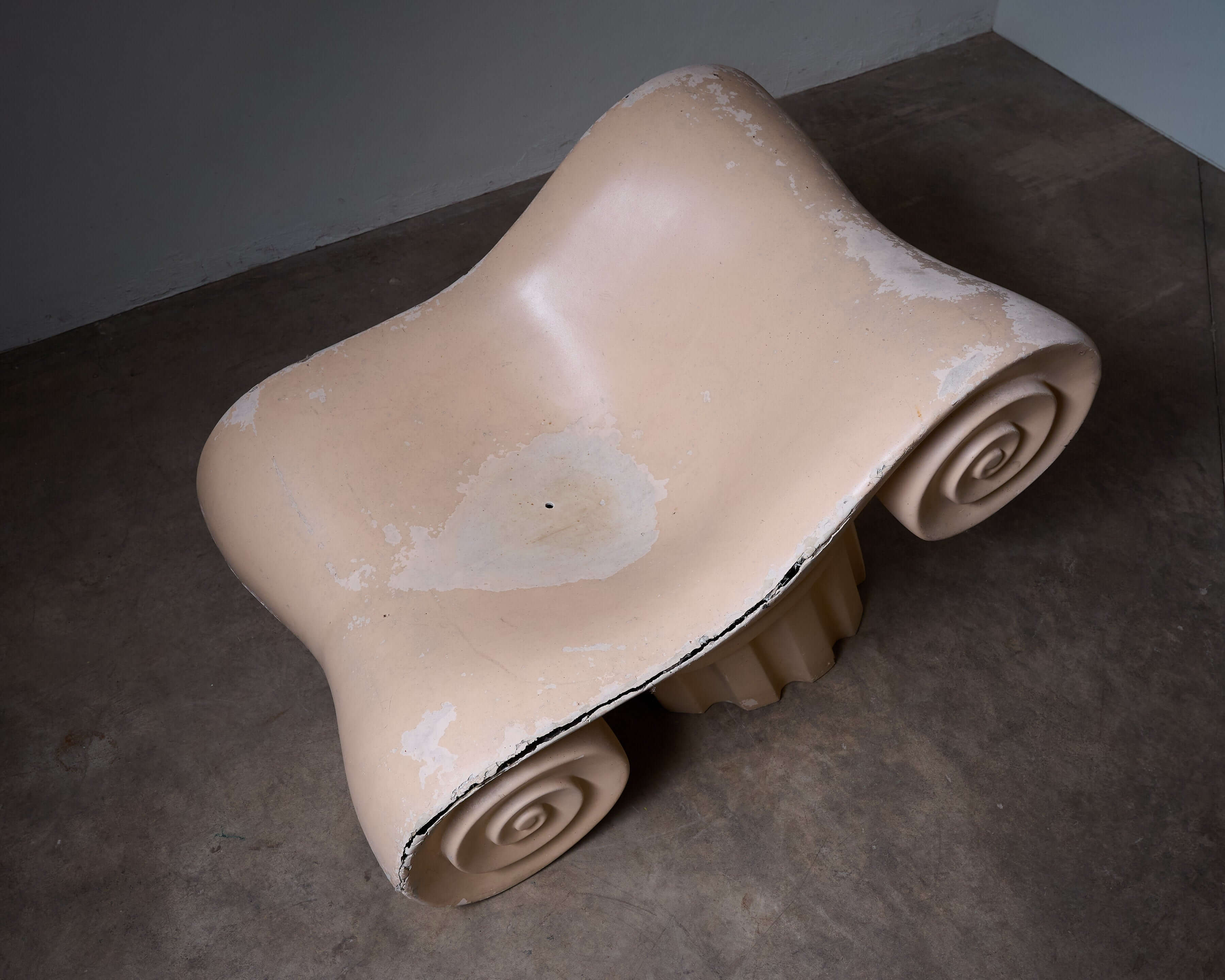 Capitello Chair in a soft beige color featuring unique scroll design, inspired by the Acropolis in Athens.